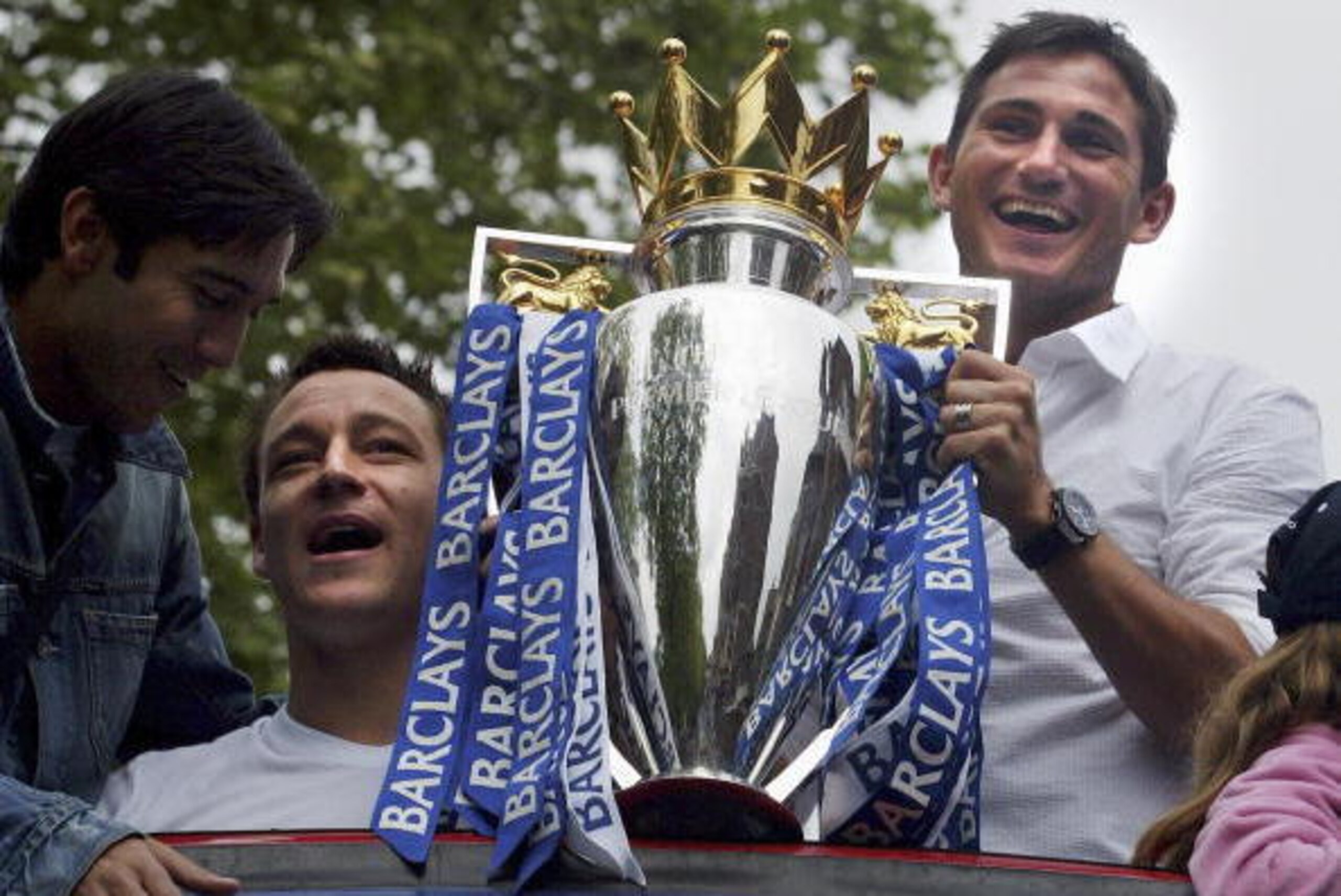LONDON - MAY 14:   John Terry and Frank Lampard show the Premiership Trophy to the fans on the open-topped bus parade of the Barclays Premiership trophy and the FA Community Shield as they make their way down New King's Road on the Chelsea Football Club v