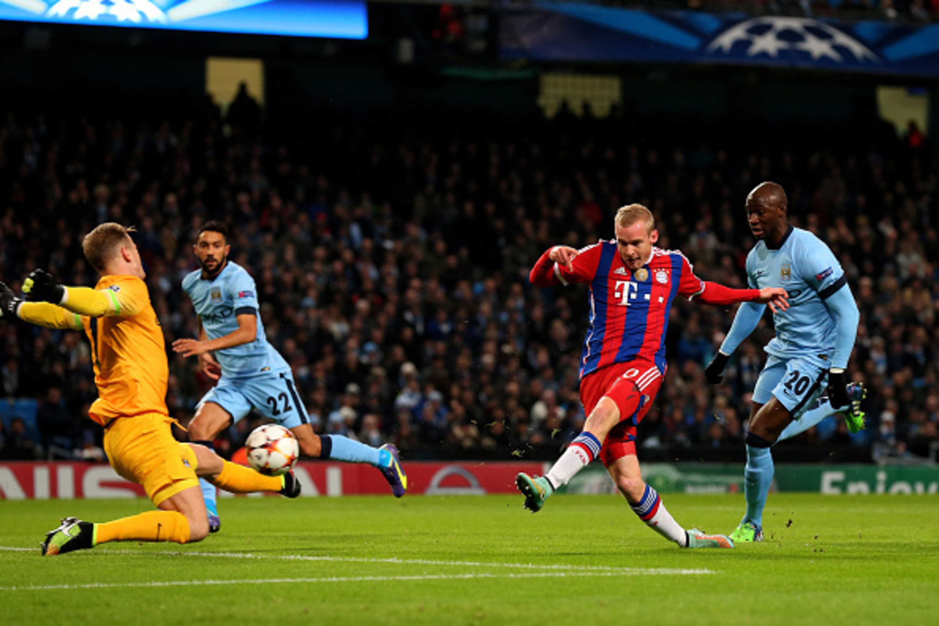 MANCHESTER, ENGLAND - NOVEMBER 25:  Sebastian Rode of Bayern Muenchen has his shot on goal saved by Joe Hart of Manchester City during the UEFA Champions League Group E match between Manchester City and FC Bayern Muenchen at the Etihad Stadium on November