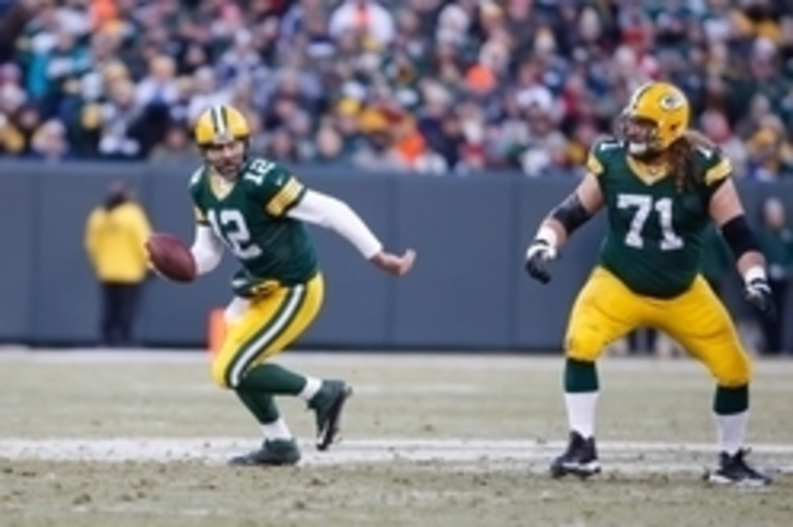 Nov 30, 2014; Green Bay, WI, USA; Green Bay Packers quarterback Aaron Rodgers (12) and guard Josh Sitton (71) during the game against the New England Patriots at Lambeau Field. Mandatory Credit: Chris Humphreys-USA TODAY Sports