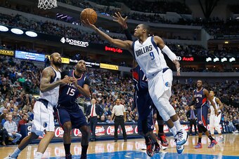 DALLAS, TX - DECEMBER 22:  Rajon Rondo #9 of the Dallas Mavericks drives to the basket against the Atlanta Hawks in the second half at American Airlines Center on December 22, 2014 in Dallas, Texas. NOTE TO USER: User expressly acknowledges and agrees tha