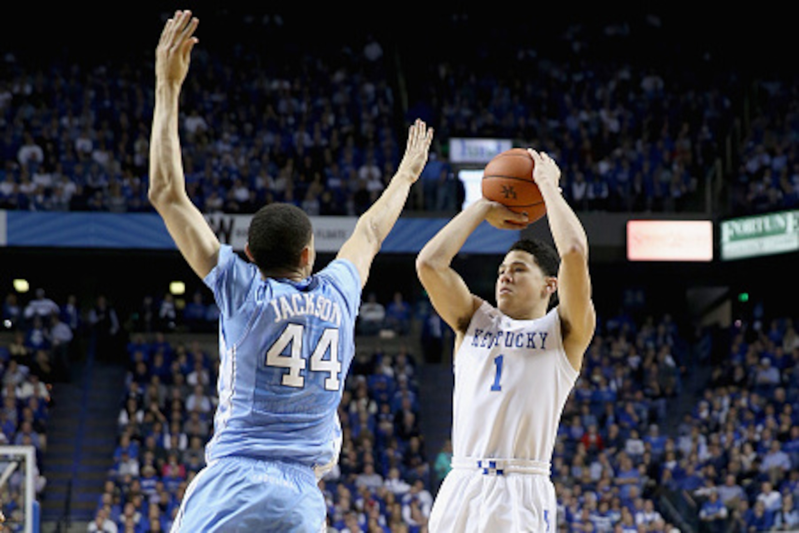 LEXINGTON, KY - DECEMBER 13:  Devin Booker #1 of the Kentucky Wildcats shoots the ball while defended by Justin Jackson #44 of the  North Carolina Tar Heels during the game at Rupp Arena on December 13, 2014 in Lexington, Kentucky.  (Photo by Andy Lyons/G