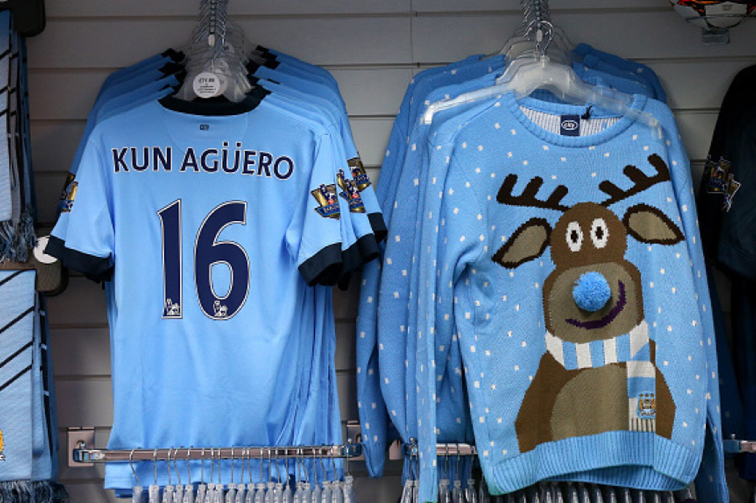 MANCHESTER, ENGLAND - DECEMBER 06:  A Christmas sweater is displayed for sale next to Manchester City replica shirts in the club store before the Barclays Premier League match between Manchester City and Everton at Etihad Stadium on December 6, 2014 in Ma