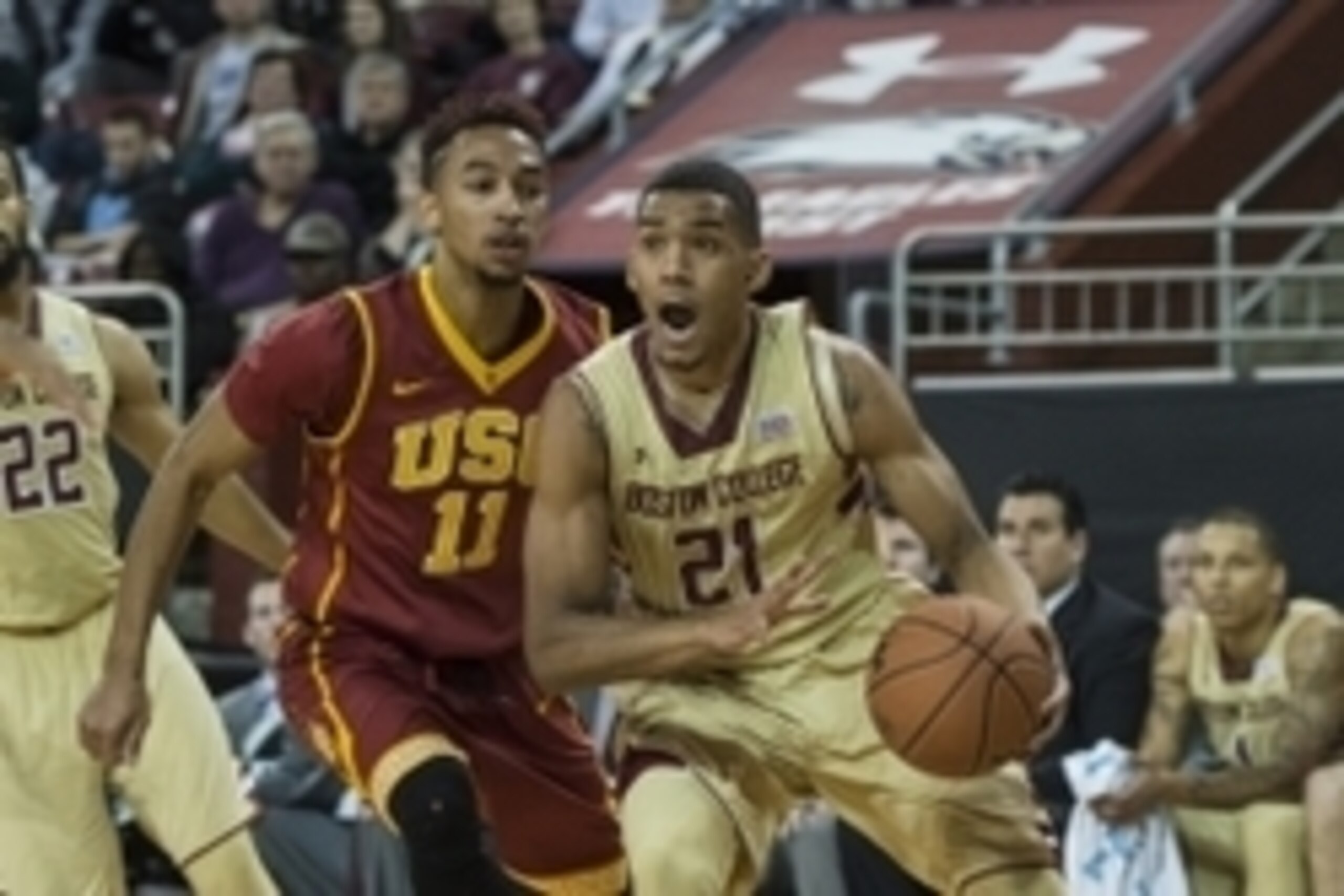Dec 21, 2014; Chestnut Hill, MA, USA; Boston College Eagles guard Olivier Hanlan (21) makes a move to the basket against Southern California Trojans guard Jordan McLauglin (11) during the second half at Silvio O. Conte Forum.  The Trojans won 75-71.  Mand