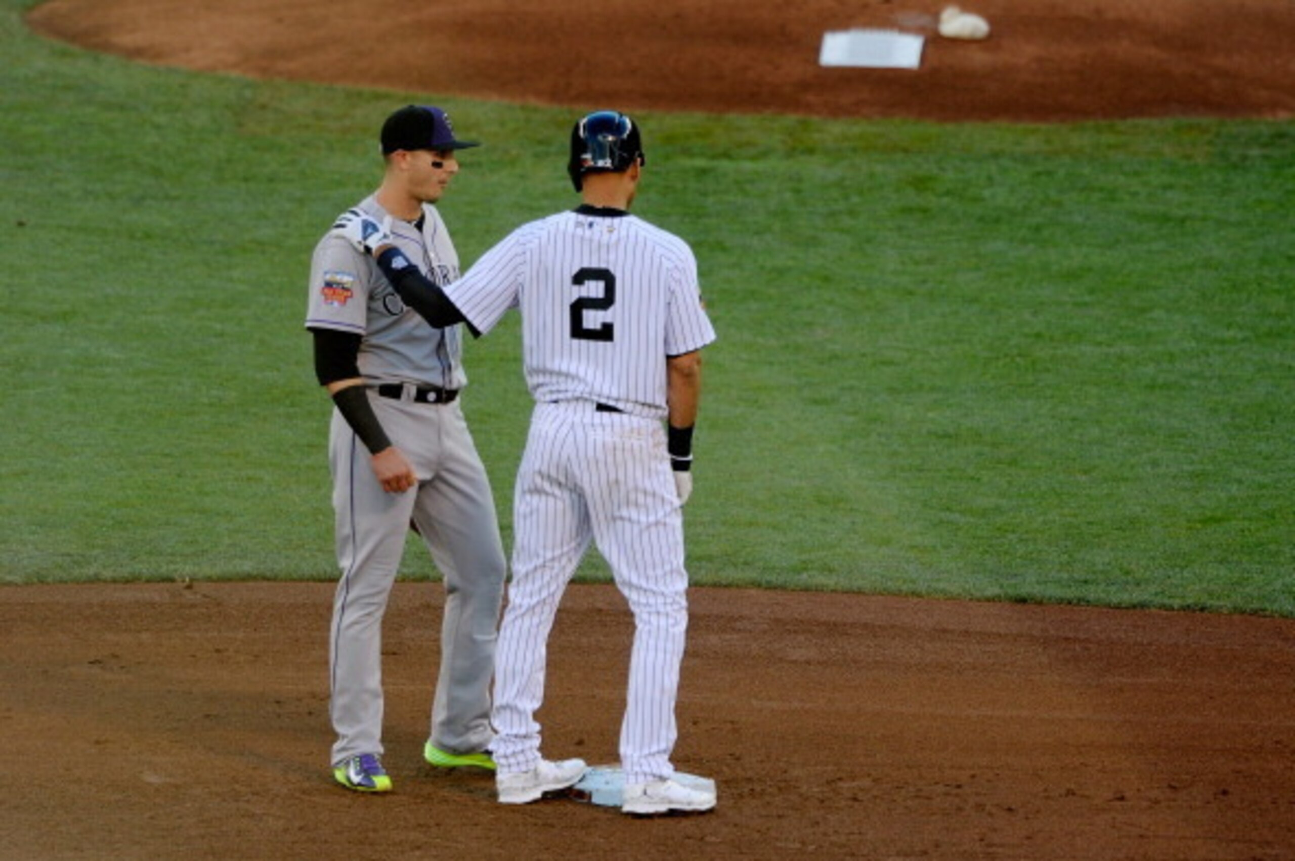 MINNEAPOLIS, MN - JULY 15:  American League All-Star Derek Jeter #2 of the New York Yankees speaks with National League All-Star Troy Tulowitzki #2 of the Colorado Rockies during the 85th MLB All-Star Game at Target Field on July 15, 2014 in Minneapolis, 