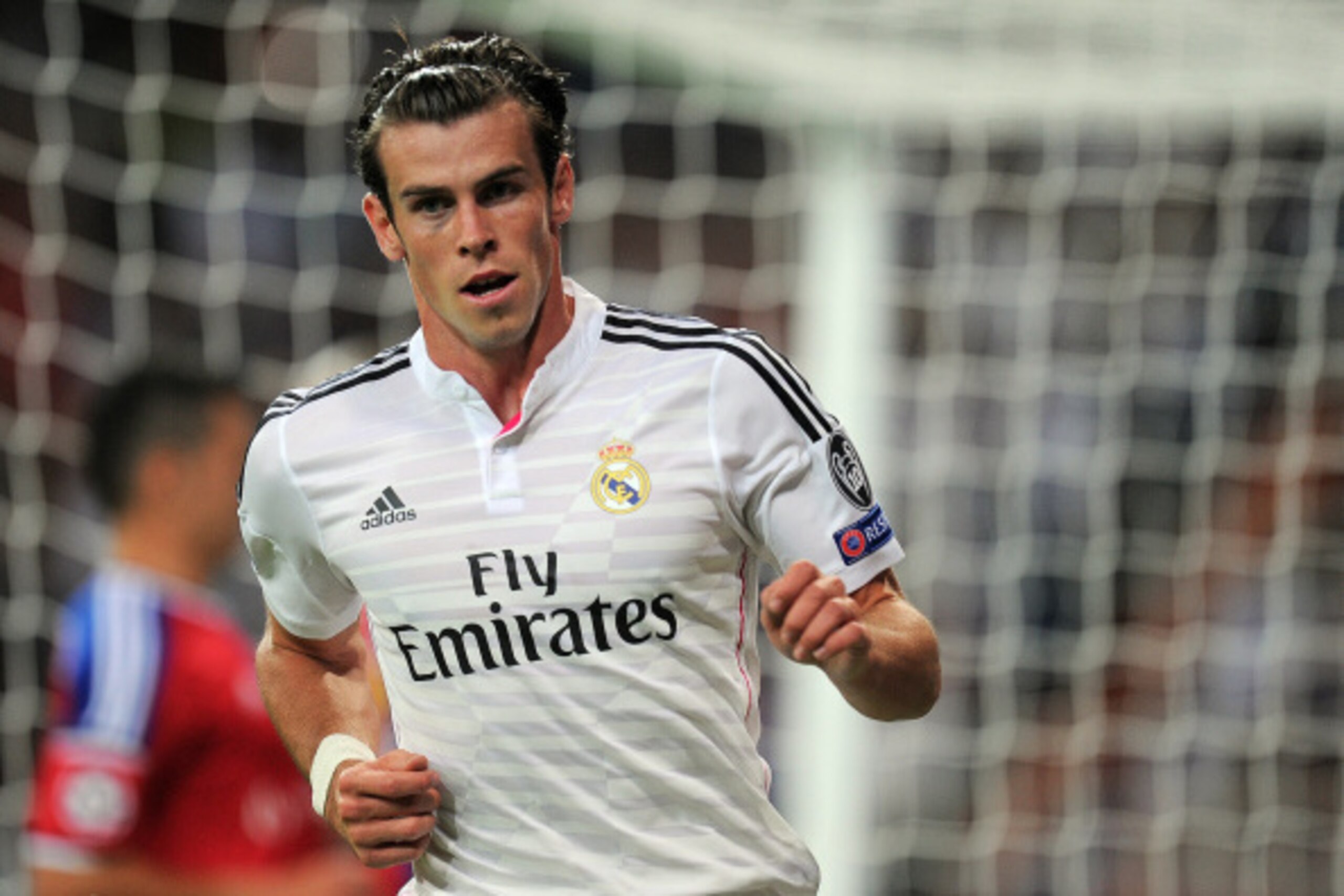 MADRID, SPAIN - SEPTEMBER 16:  Gareth Bale of Real Madrid celebrates after scoring Real's seconnd goal during the UEFA Champions League Group B match between Real Madrid CF and FC Basel 1893 on September 16, 2014 in Madrid, Spain.  (Photo by Denis Doyle/G