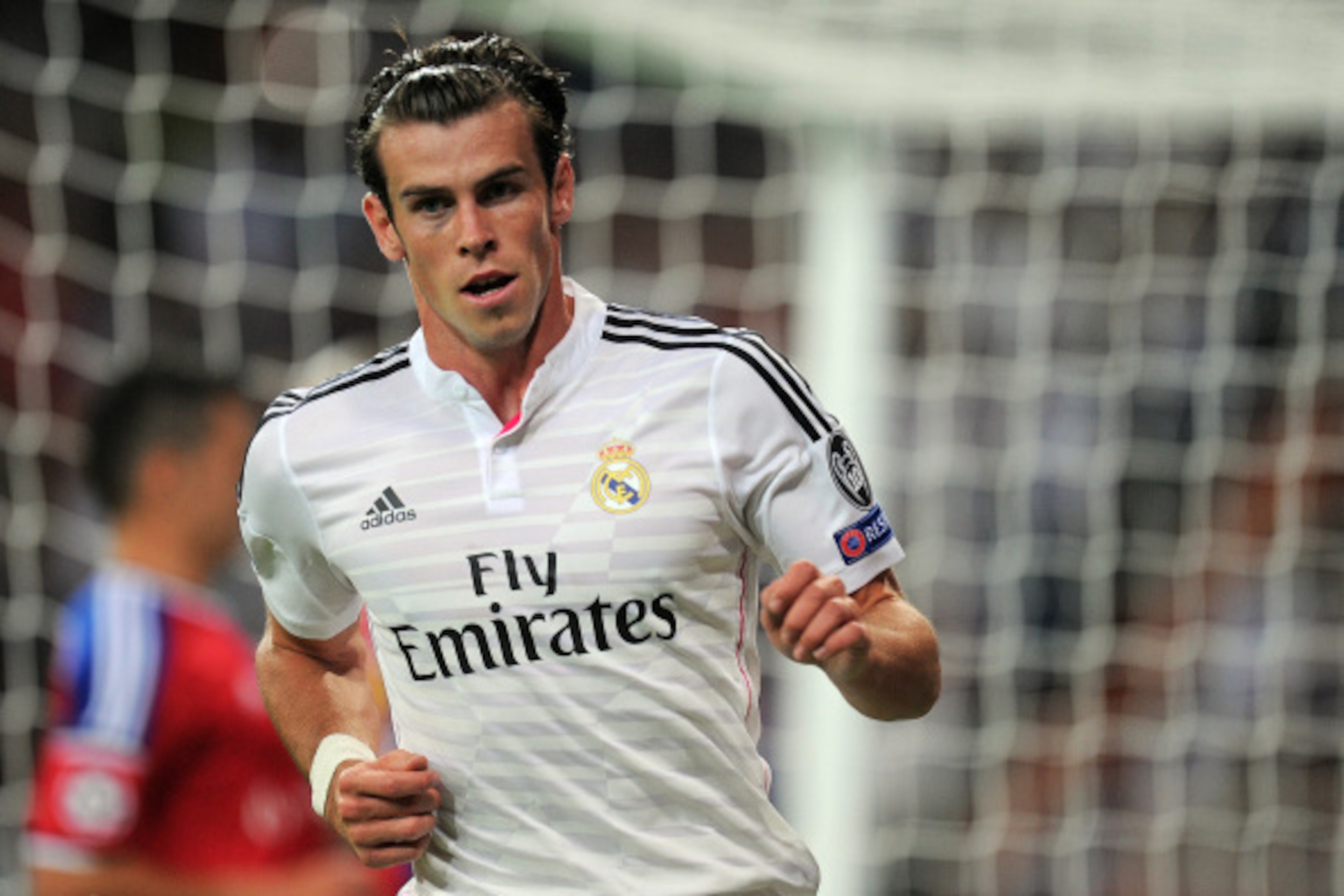 MADRID, SPAIN - SEPTEMBER 16:  Gareth Bale of Real Madrid celebrates after scoring Real's seconnd goal during the UEFA Champions League Group B match between Real Madrid CF and FC Basel 1893 on September 16, 2014 in Madrid, Spain.  (Photo by Denis Doyle/G