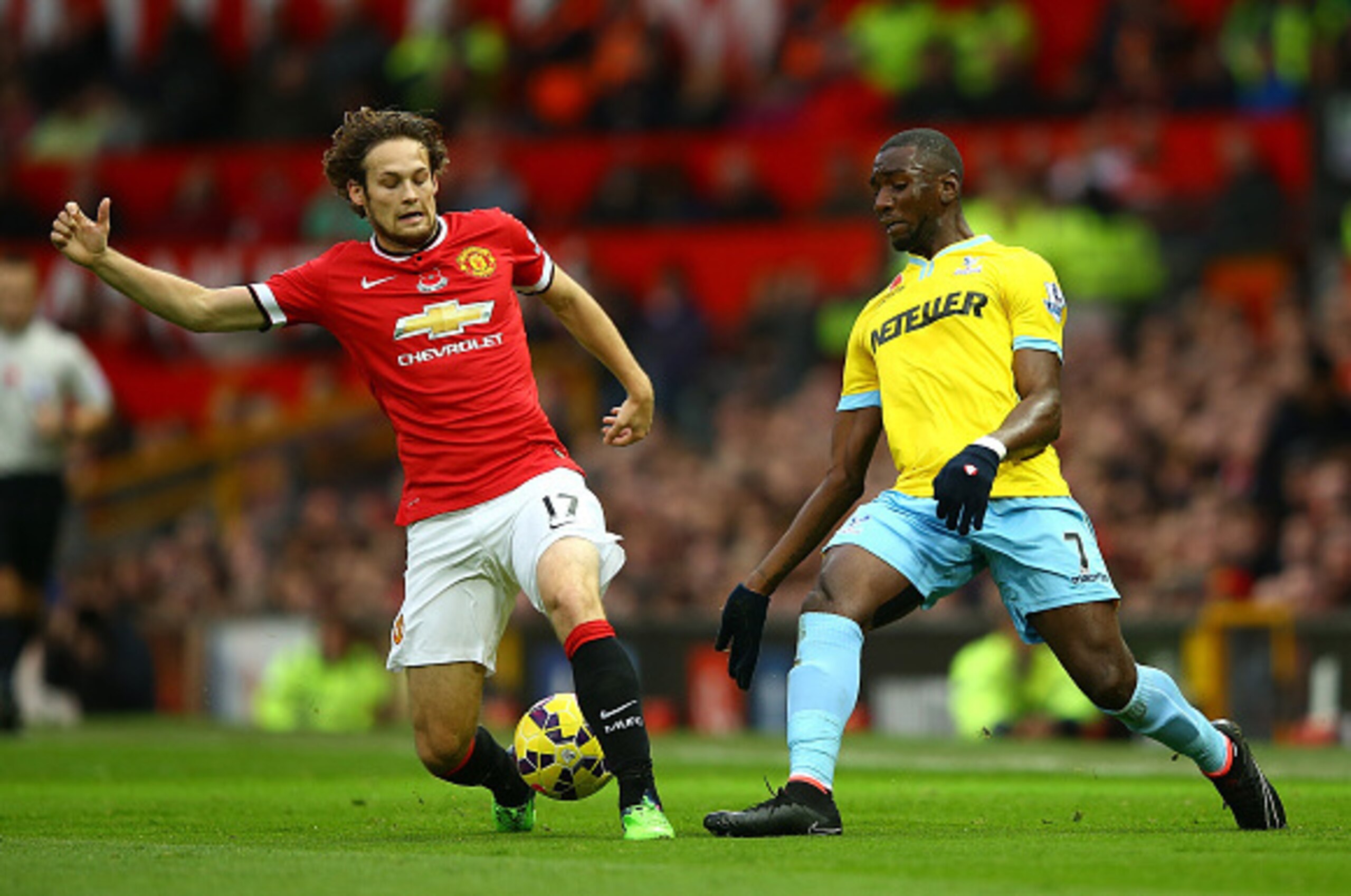 MANCHESTER, ENGLAND - NOVEMBER 08: Daley Blind of Manchester United competes with Yannick Bolasie of Crystal Palace during the Barclays Premier League match between Manchester United and Crystal Palace at Old Trafford on November 8, 2014 in Manchester, E MANCHESTER, ENGLAND - NOVEMBER 08: Daley Blind of Manchester United competes with Yannick Bolasie of Crystal Palace during the Barclays Premier League match between Manchester United and Crystal Palace at Old Trafford on November 8, 2014 in Manchester, E