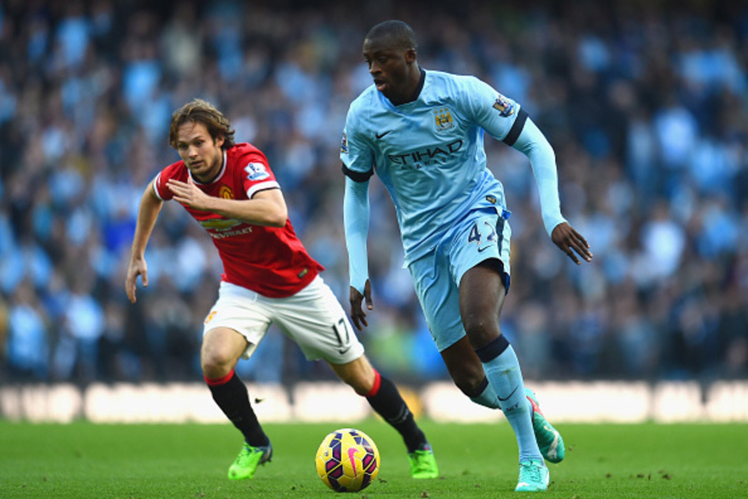MANCHESTER, ENGLAND - NOVEMBER 02: Daley Blind of Manchester United chases down Yaya Toure of Manchester City during the Barclays Premier League match between Manchester City and Manchester United at Etihad Stadium on November 2, 2014 in Manchester, Engla MANCHESTER, ENGLAND - NOVEMBER 02: Daley Blind of Manchester United chases down Yaya Toure of Manchester City during the Barclays Premier League match between Manchester City and Manchester United at Etihad Stadium on November 2, 2014 in Manchester, Engla