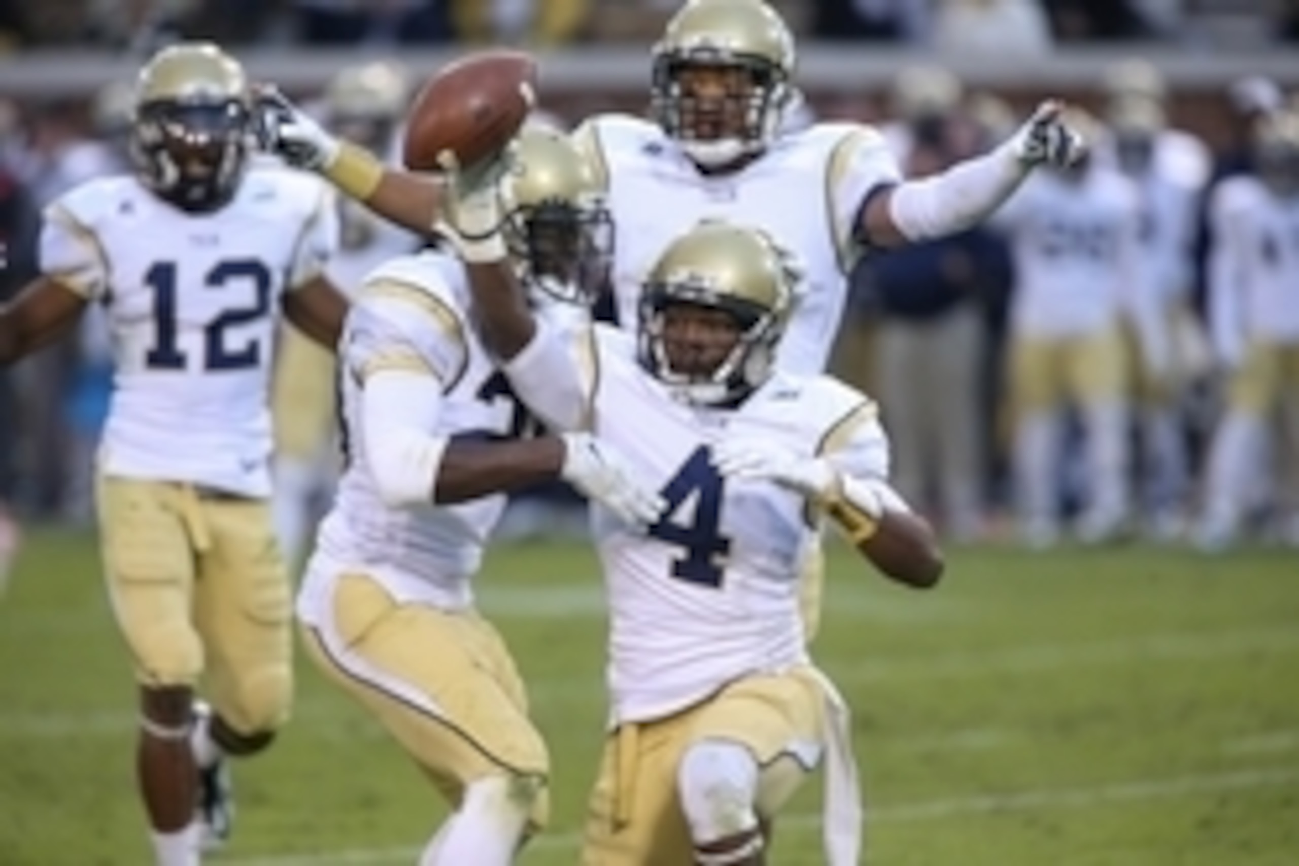 Nov 1, 2014; Atlanta, GA, USA; Georgia Tech Yellow Jackets defensive back Jamal Golden (4) celebrates an interception in their game against the Virginia Cavaliers at Bobby Dodd Stadium. The play was overturned and was not ruled an interception. Georgia Te