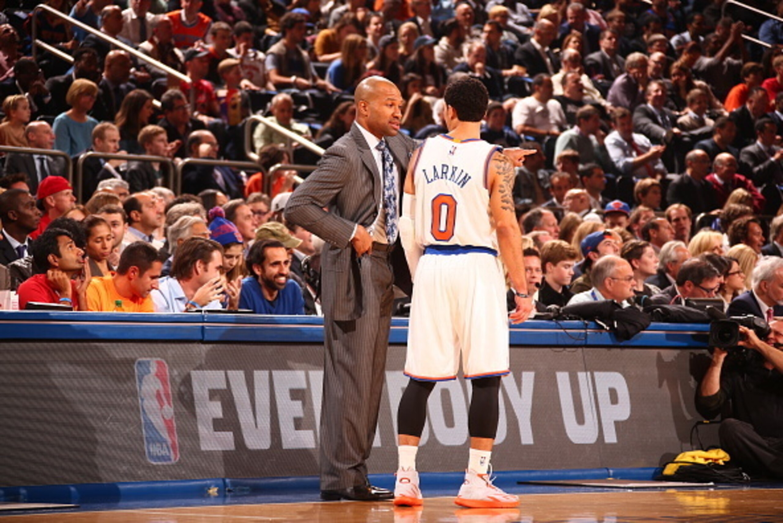 NEW YORK, NY - OCTOBER 29:  Head coach Derek Fisher of the New York Knicks talks with Shane Larkin #0 during a game against the Chicago Bulls at Madison Square Garden in New York City on October 29, 2014.  NOTE TO USER: User expressly acknowledges and agr