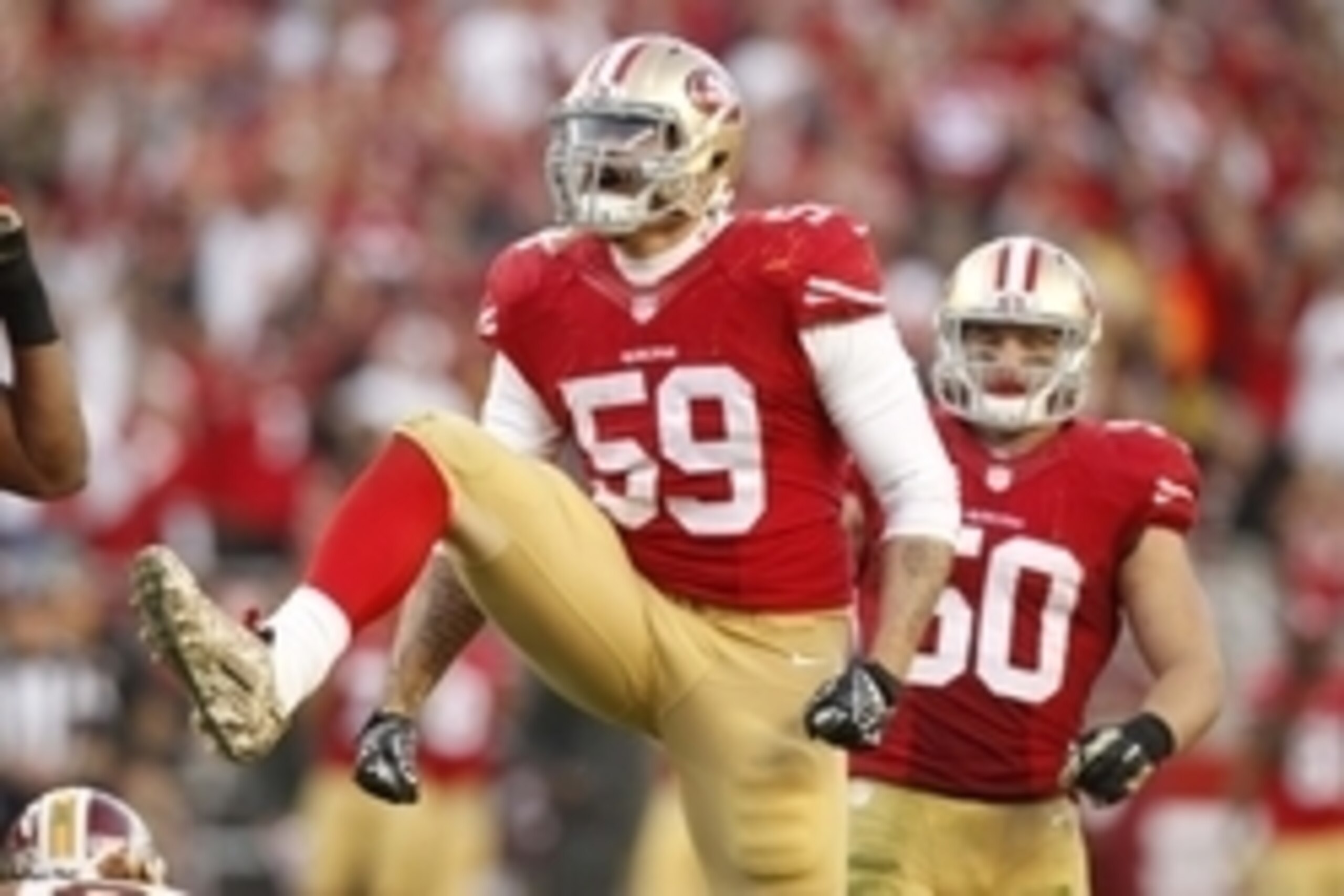 Nov 23, 2014; Santa Clara, CA, USA; San Francisco 49ers outside linebacker Aaron Lynch (59) reacts after the 49ers made a defensive stop against the Washington Redskins in the fourth quarter at Levi's Stadium. The 49ers defeated the Redskins 17-13. Mandat