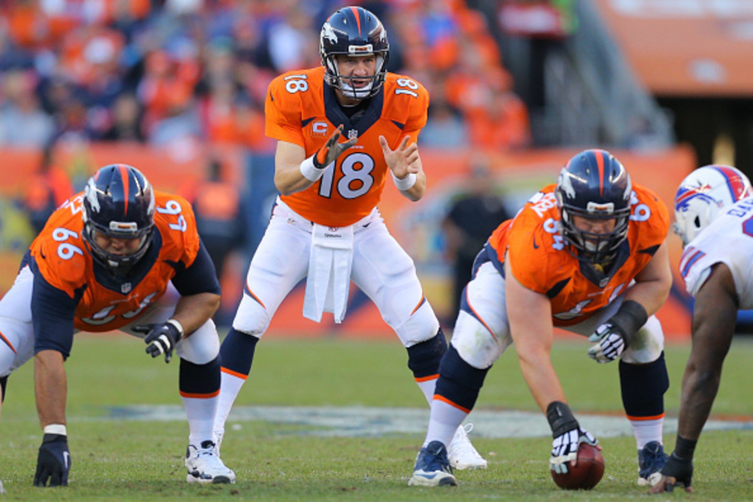 DENVER, CO - DECEMBER 7:  Quarterback Peyton Manning #18 of the Denver Broncos walks off the field against the Buffalo Bills at Sports Authority Field Field at Mile High on December 7, 2014 in Denver, Colorado. (Photo by Justin Edmonds/Getty Images)