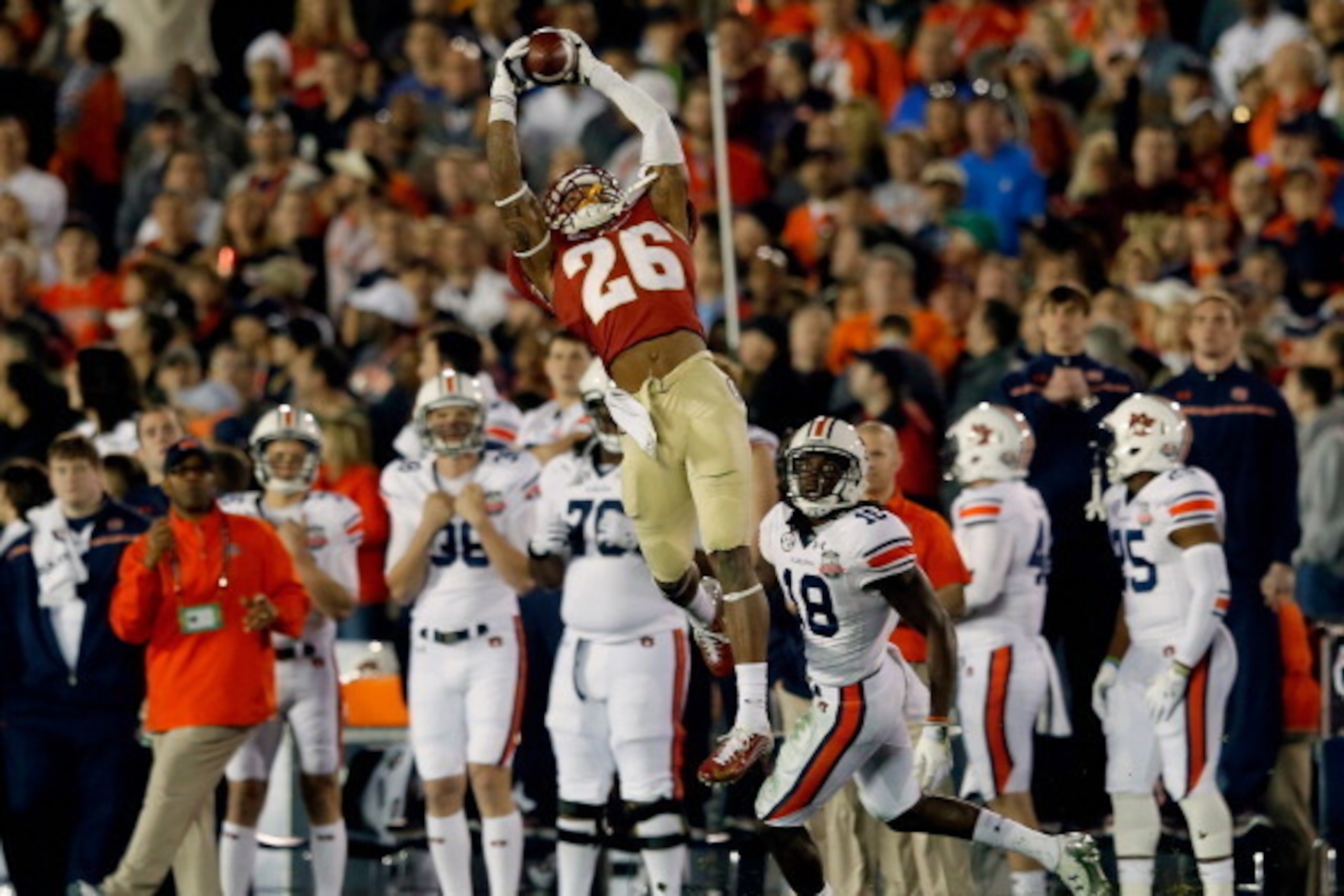 PASADENA, CA - JANUARY 06:  Defensive back P.J. Williams #26 of the Florida State Seminoles intercepts a pass in the fourth quarter against the Auburn Tigers during the 2014 Vizio BCS National Championship Game at the Rose Bowl on January 6, 2014 in Pasad