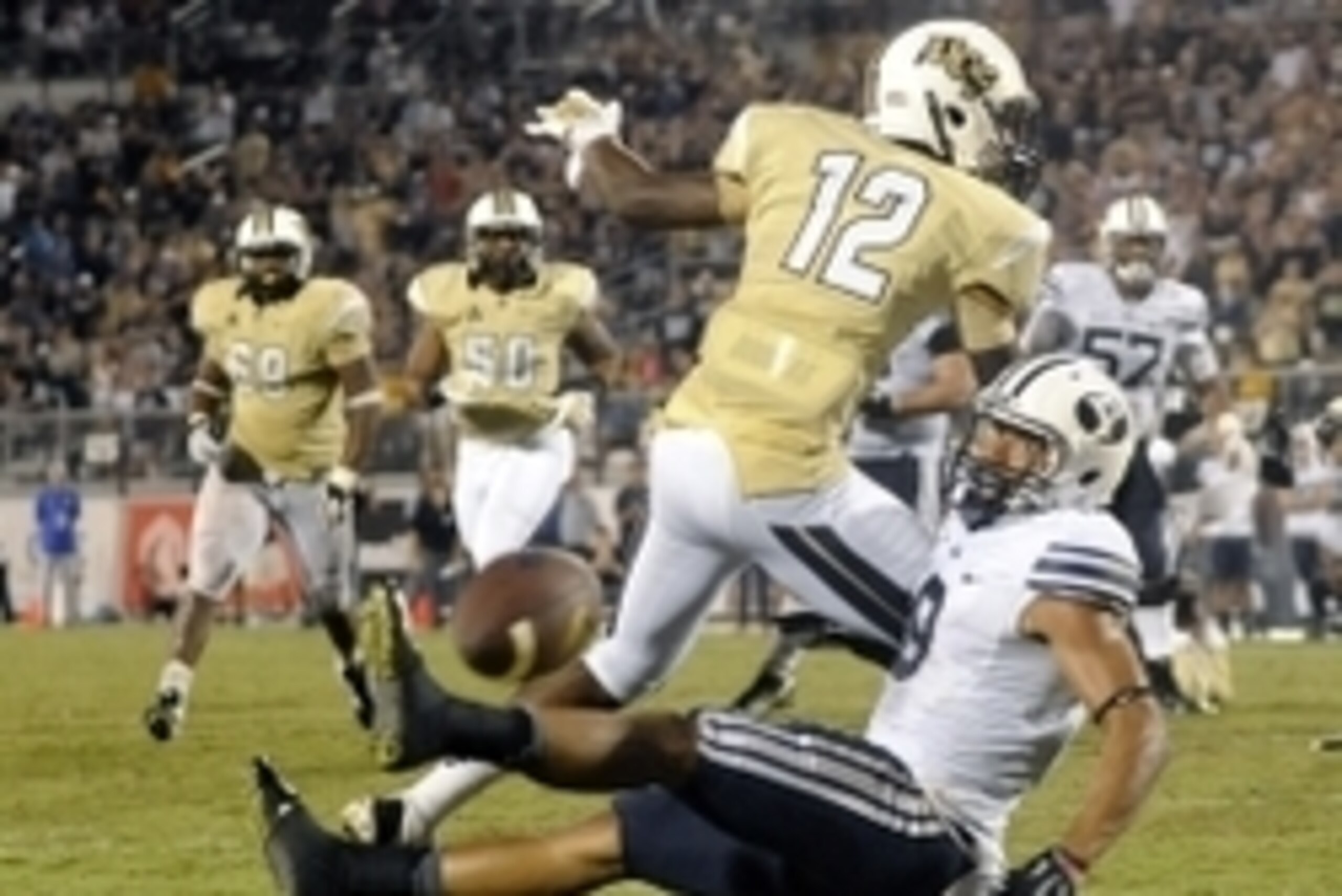 Oct 9, 2014; Orlando, FL, USA; Brigham Young Cougars wide receiver Jordan Leslie (9) looks back at an incomplete pass on the final play of the game while UCF Knights defensive back Jacoby Glenn (12) defends as the  Knights beat the Cougars 31-24 in overti