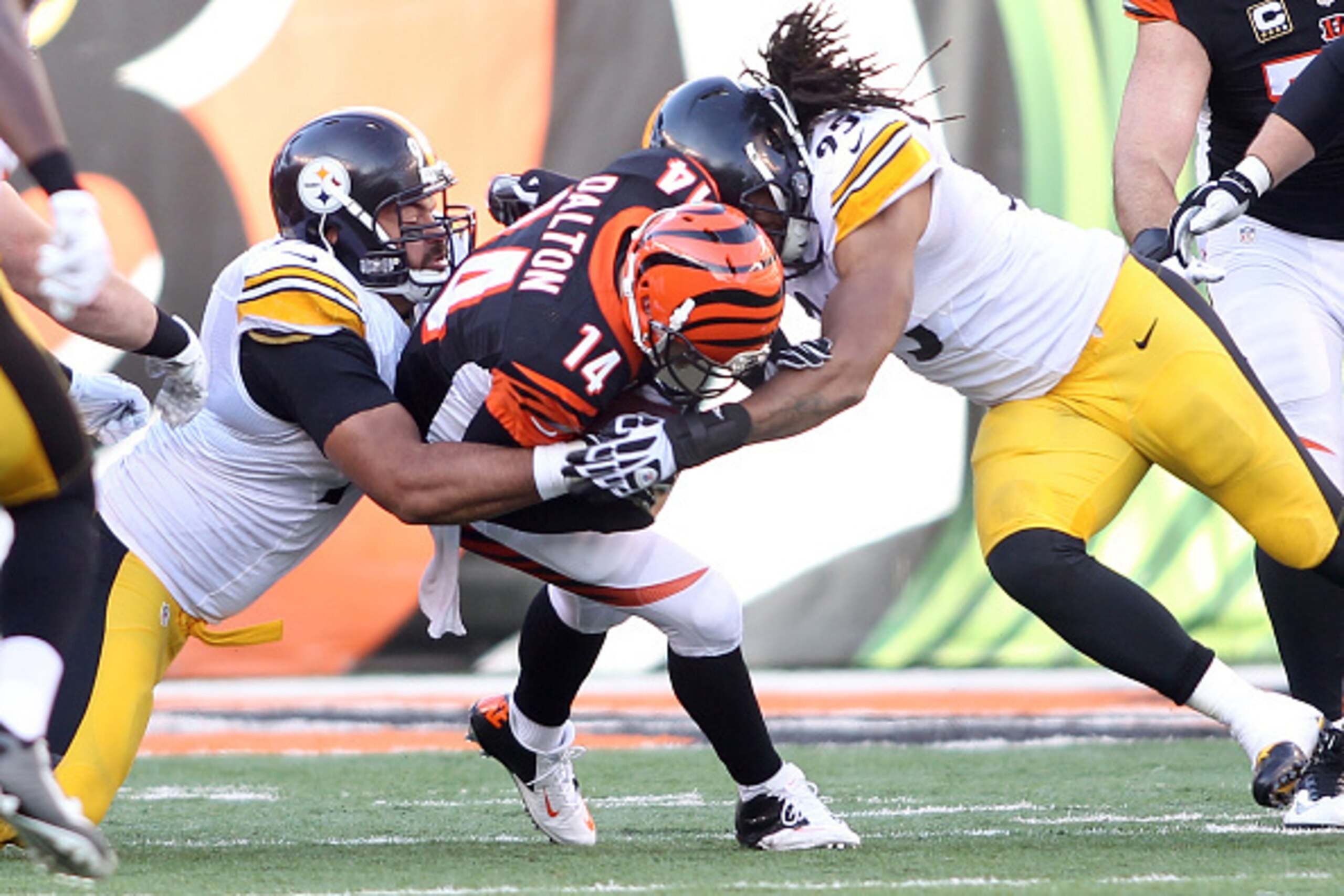 CINCINNATI, OH - DECEMBER 7:  Cameron Heyward #97 of the Pittsburgh Steelers and Jarvis Jones #95 of the Pittsburgh Steelers combine to tackle Andy Dalton #14 of the Cincinnati Bengals during the third quarter at Paul Brown Stadium on December 7, 2014 in 