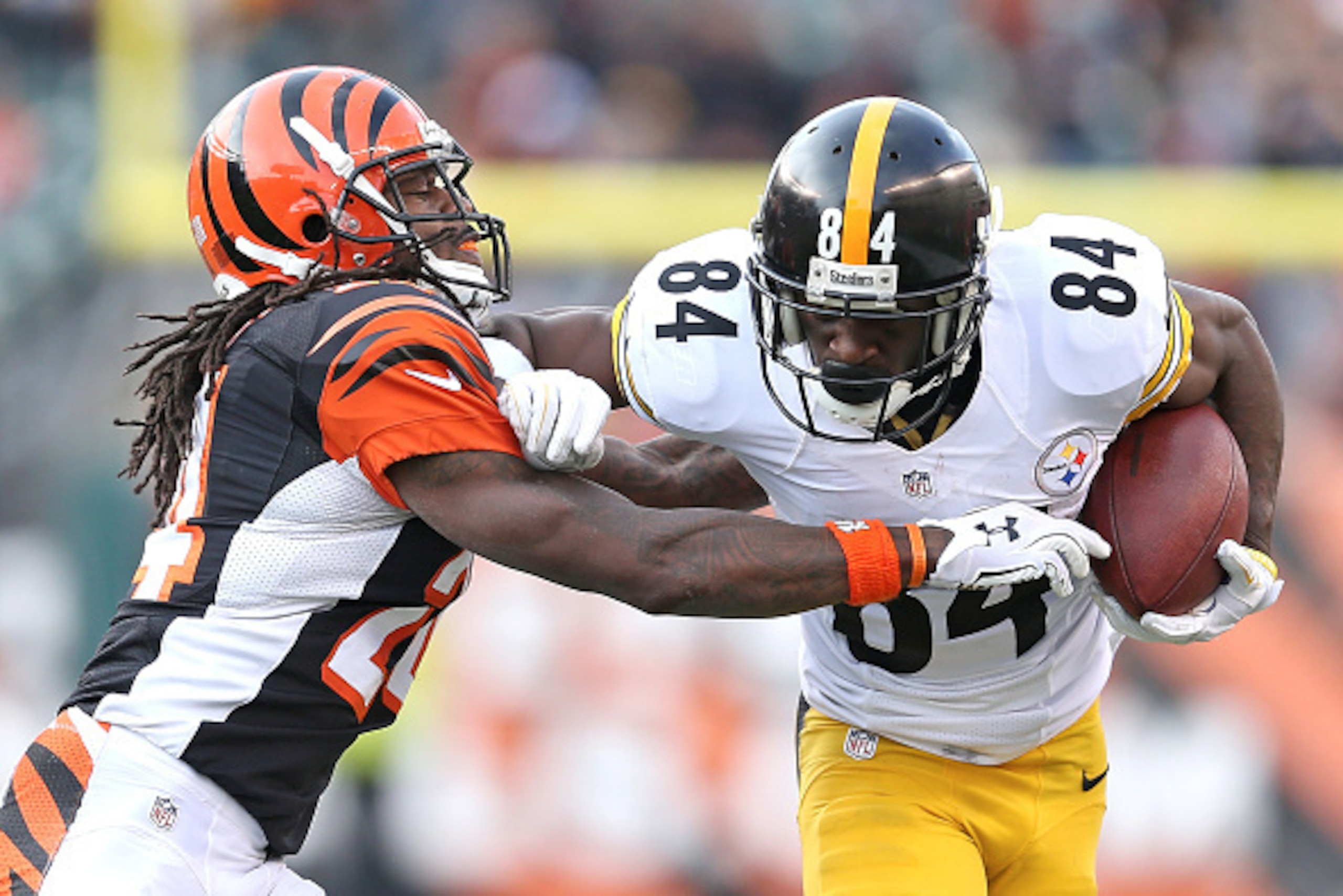 CINCINNATI, OH - DECEMBER 7: Adam Jones #24 of the Cincinnati Bengals attempts to tackle Antonio Brown #84 of the Pittsburgh Steelers during the fourth quarter at Paul Brown Stadium on December 7, 2014 in Cincinnati, Ohio. Pittsburgh defeated Cincinnati CINCINNATI, OH - DECEMBER 7: Adam Jones #24 of the Cincinnati Bengals attempts to tackle Antonio Brown #84 of the Pittsburgh Steelers during the fourth quarter at Paul Brown Stadium on December 7, 2014 in Cincinnati, Ohio. Pittsburgh defeated Cincinnati