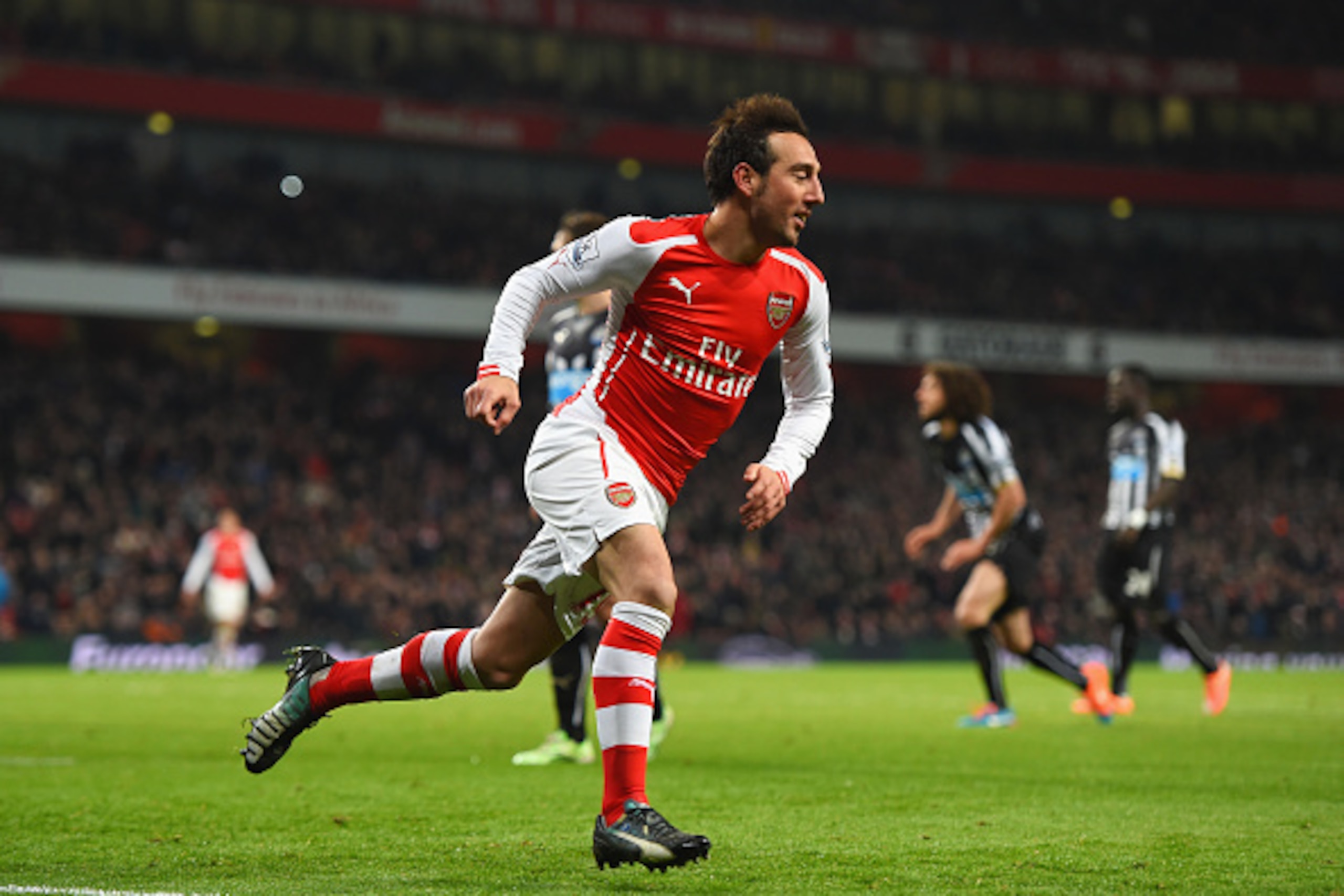 LONDON, ENGLAND - DECEMBER 13:  Santi Cazorla of Arsenal celebrates scoring his team's second goal during the Barclays Premier League match between Arsenal and Newcastle United at Emirates Stadium on December 13, 2014 in London, England.  (Photo by Paul G