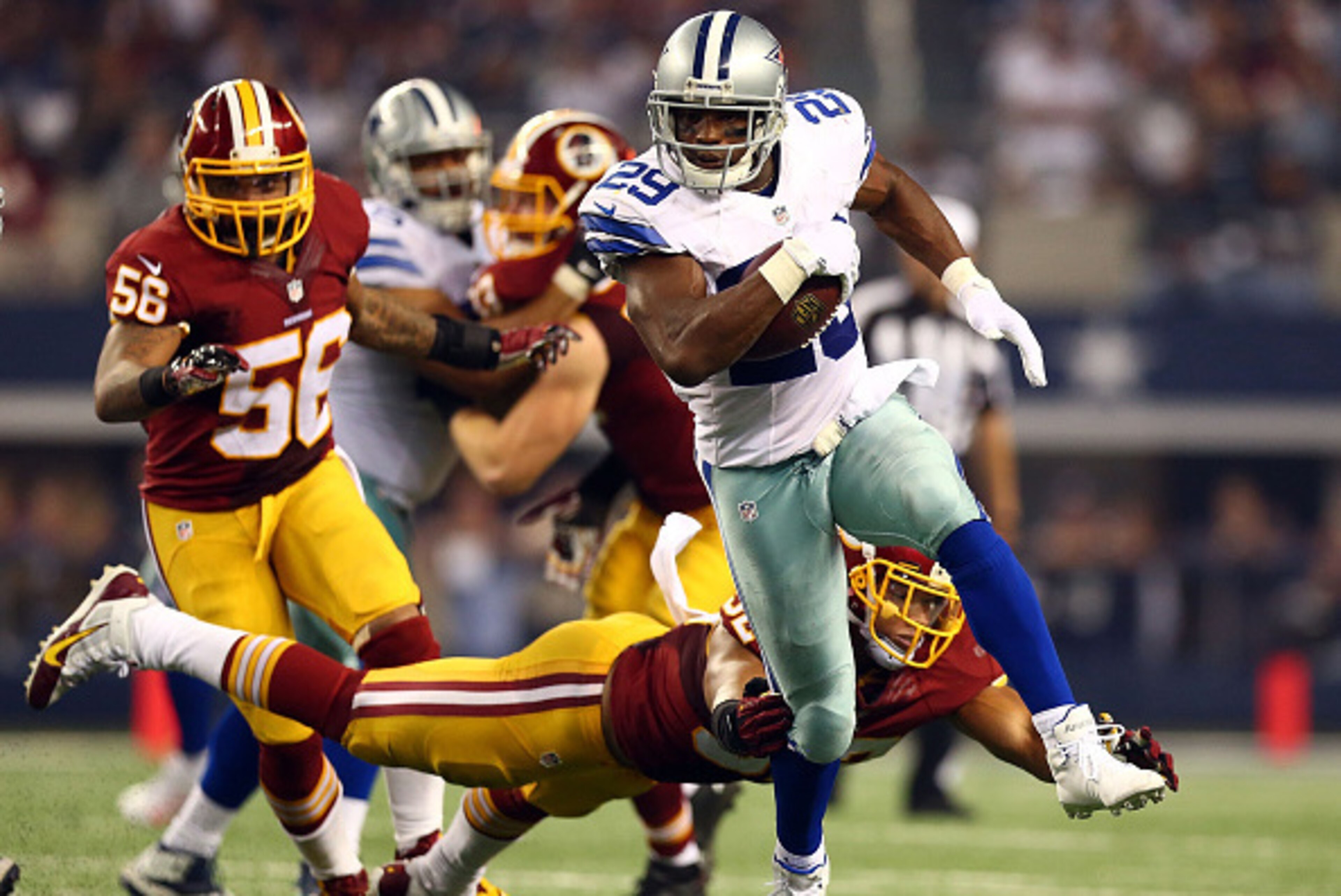 ARLINGTON, TX - OCTOBER 27:  DeMarco Murray #29 of the Dallas Cowboys carries the ball against the Washington Redskins during the second half at AT&T Stadium on October 27, 2014 in Arlington, Texas.  (Photo by Ronald Martinez/Getty Images)