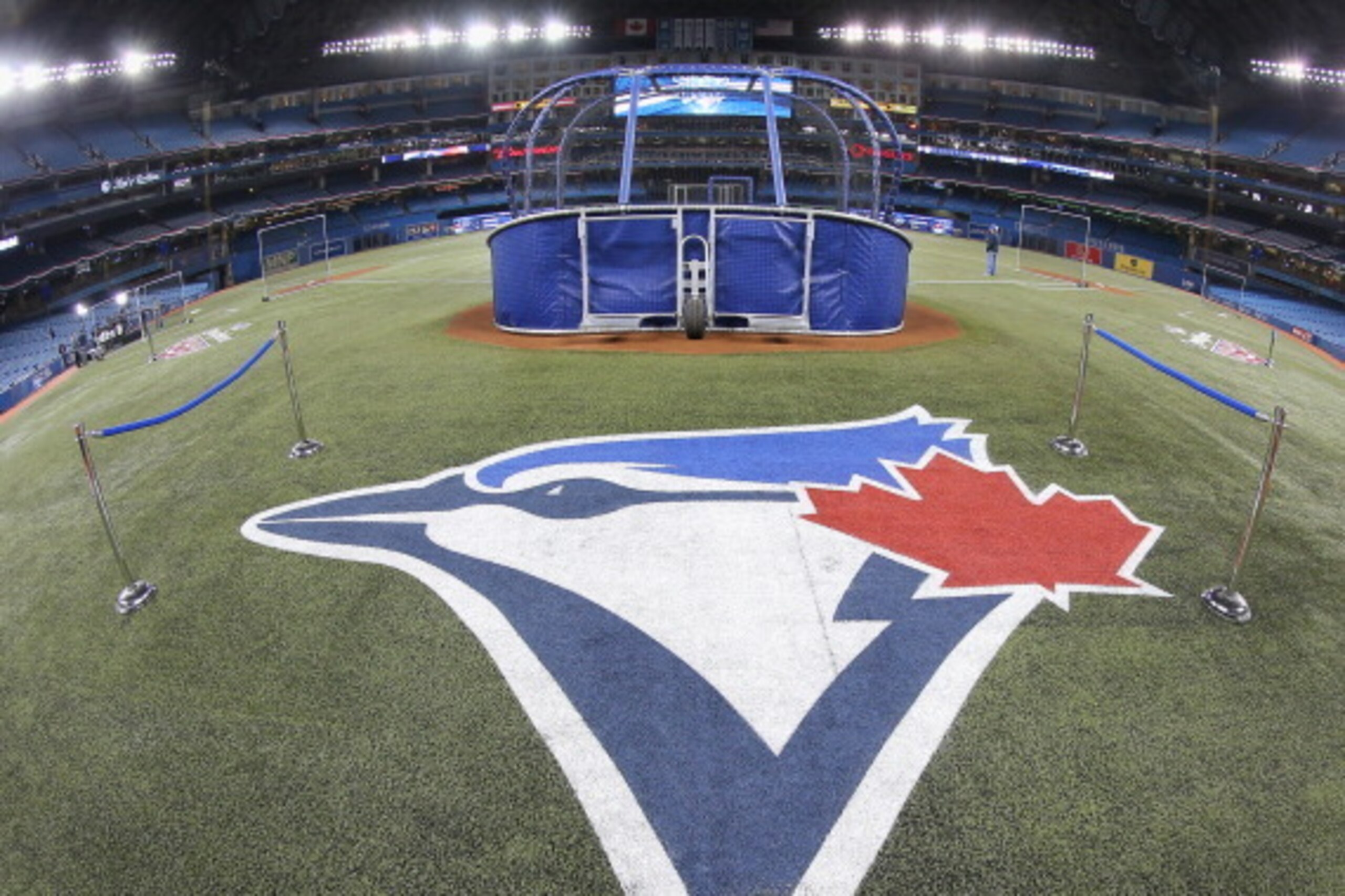 TORONTO, CANADA - APRIL 4: The Toronto Blue Jays logo painted on the field during batting practice before the Toronto Blue Jays home opener prior to the start of their MLB game against the New York Yankees on April 4, 2014 at Rogers Centre in Toronto, Ont