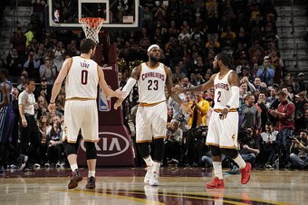 CLEVELAND, OH - DECEMBER 15:  LeBron James #23, Kevin Love #0 and Kyrie Irving #2 of the Cleveland Cavaliers shake hands during the game against the Charlotte Hornets on December 15, 2014 at Quicken Loans Arena in Cleveland, Ohio. NOTE TO USER: User expre