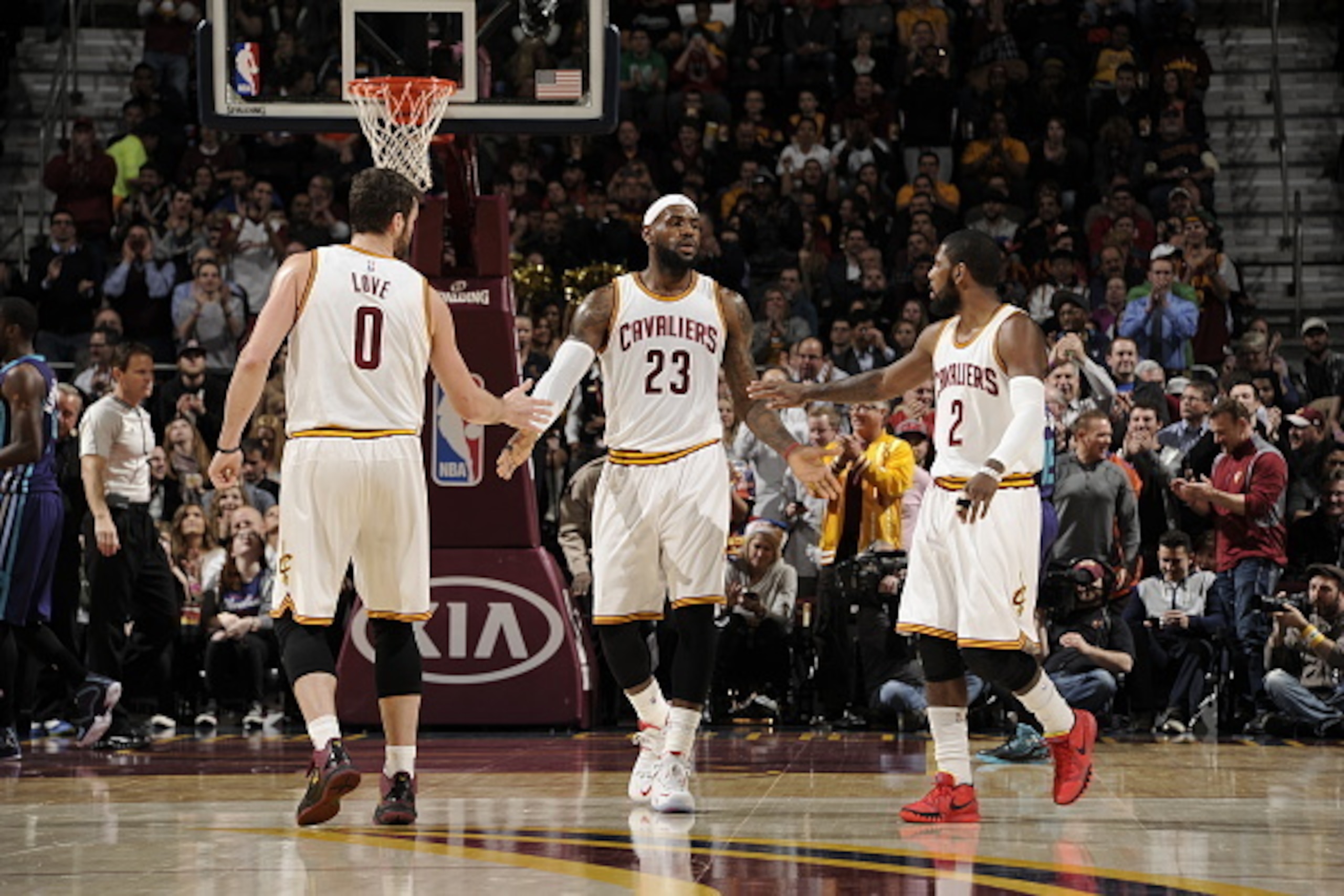 CLEVELAND, OH - DECEMBER 15:  LeBron James #23, Kevin Love #0 and Kyrie Irving #2 of the Cleveland Cavaliers shake hands during the game against the Charlotte Hornets on December 15, 2014 at Quicken Loans Arena in Cleveland, Ohio. NOTE TO USER: User expre