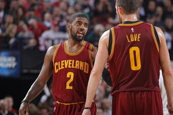 PORTLAND, OR - NOVEMBER 4:  Kyrie Irving #2 of the Cleveland Cavaliers talks with teammate Kevin Love #0 during the game against the Portland Trail Blazers on November 4, 2014 at the Moda Center in Portland, Oregon. NOTE TO USER: User expressly acknowledg