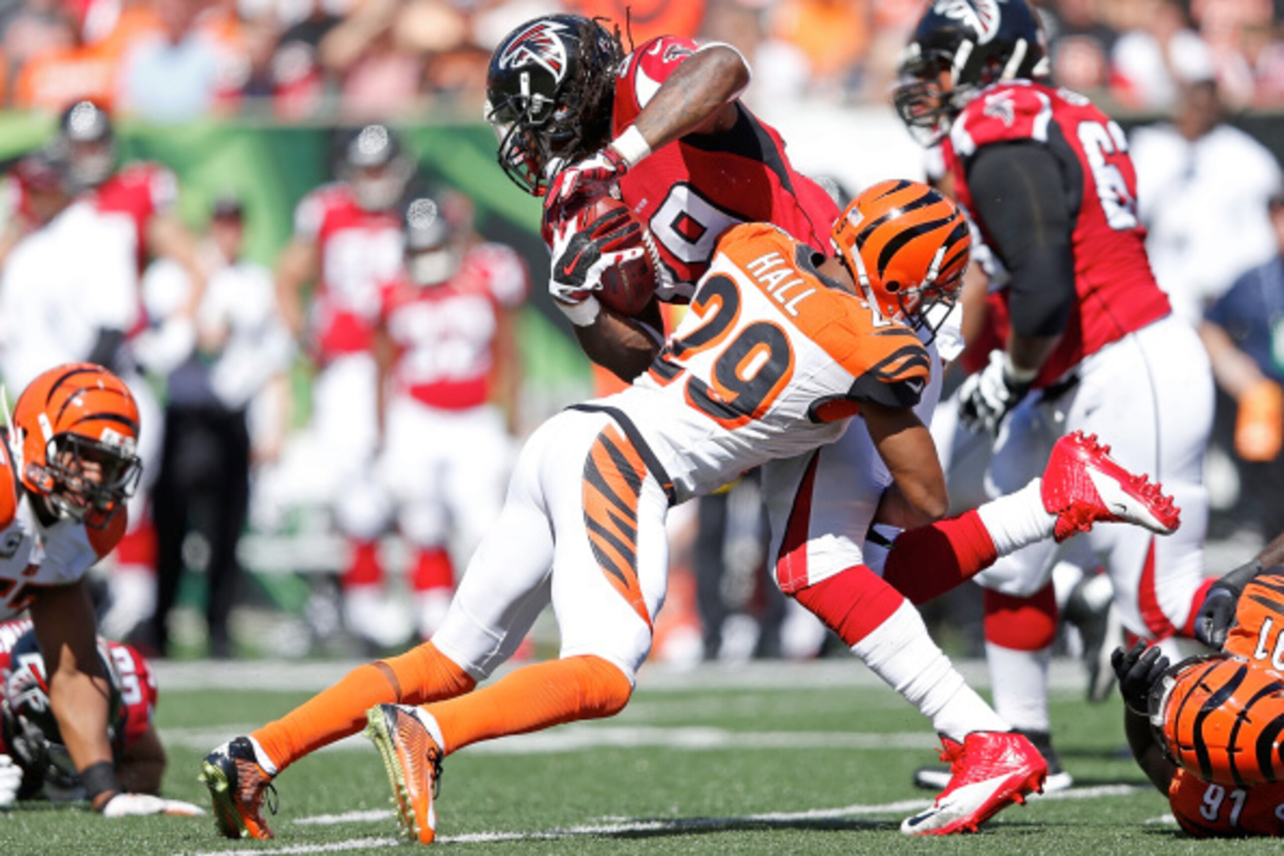 CINCINNATI, OH - SEPTEMBER 14:  Leon Hall #29 of the Cincinnati Bengals tackles Steven Jackson #39 of the Atlanta Falcons during the fourth quarter at Paul Brown Stadium on September 14, 2014 in Cincinnati, Ohio. Cincinnati defeated Atlanta 24-10. (Photo 