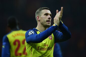ISTANBUL, TURKEY - DECEMBER 09:  Lukas Podolski of Arsenal applauds the crowd after victory in the UEFA Champions League Group D match between Galatasaray AS and Arsenal FC at Ali Sami Yen Arena on December 9, 2014 in Istanbul, Turkey.  (Photo by Jamie Mc