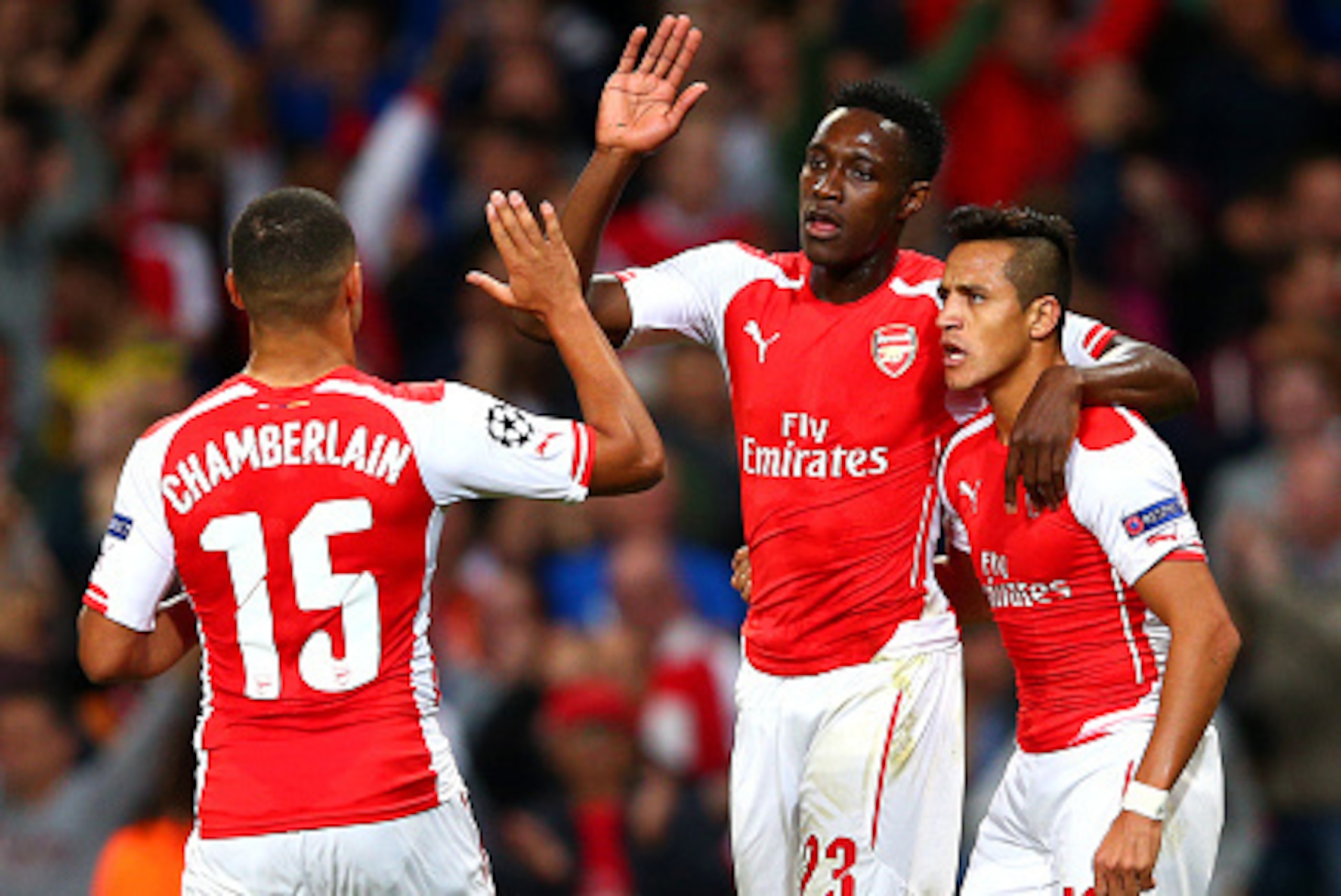 LONDON, ENGLAND - OCTOBER 01: Danny Welbeck of Arsenal celebrates with team-mates Alex Oxlade-Chamberlain and Alexis Sanchez after scoring the opening goal during the UEFA Champions League group D match between Arsenal FC and Galatasaray AS at Emirates S LONDON, ENGLAND - OCTOBER 01: Danny Welbeck of Arsenal celebrates with team-mates Alex Oxlade-Chamberlain and Alexis Sanchez after scoring the opening goal during the UEFA Champions League group D match between Arsenal FC and Galatasaray AS at Emirates S