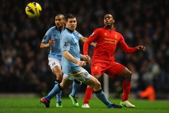 MANCHESTER, ENGLAND - FEBRUARY 03:  Daniel Sturridge of Liverpool competes with James Milner of Manchester City and Gael Clichy (L) during the Barclays Premier League match between Manchester City and Liverpool at the Etihad Stadium on February 3, 2013 in