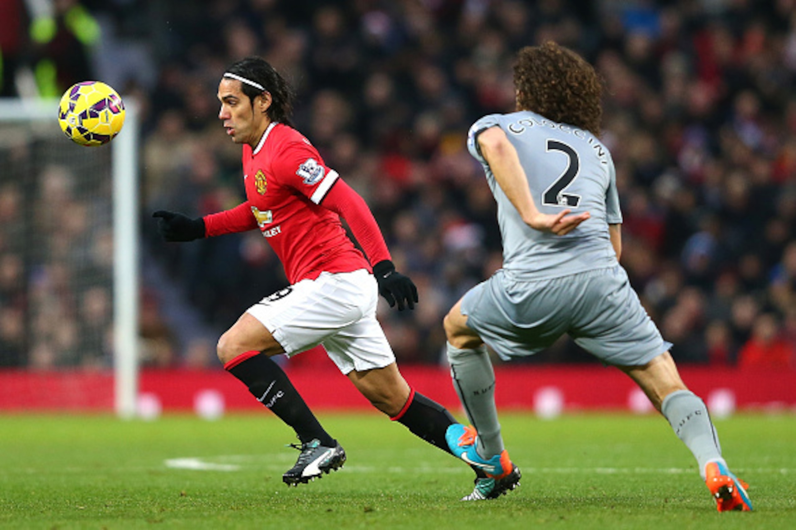 MANCHESTER, ENGLAND - DECEMBER 26:  Radamel Falcao of Manchester United competes with Fabricio Coloccini of Newcastle United during the Barclays Premier League match between Manchester United and Newcastle United at Old Trafford on December 26, 2014 in Ma