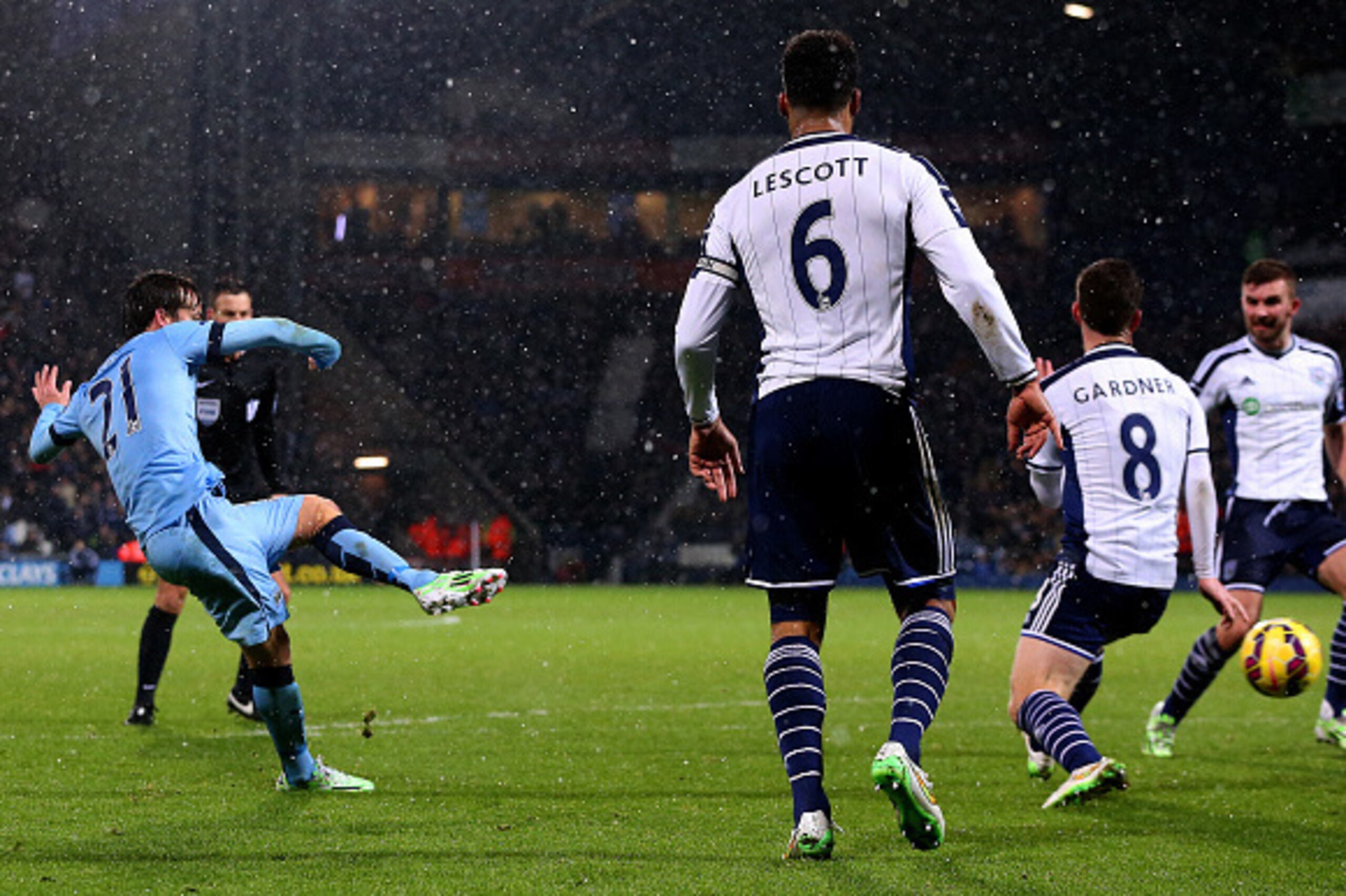 WEST BROMWICH, ENGLAND - DECEMBER 26:  David Silva of Manchester City scores his team's third goal during the Barclays Premier League match between West Bromwich Albion and Manchester City at The Hawthorns on December 26, 2014 in West Bromwich, England.  