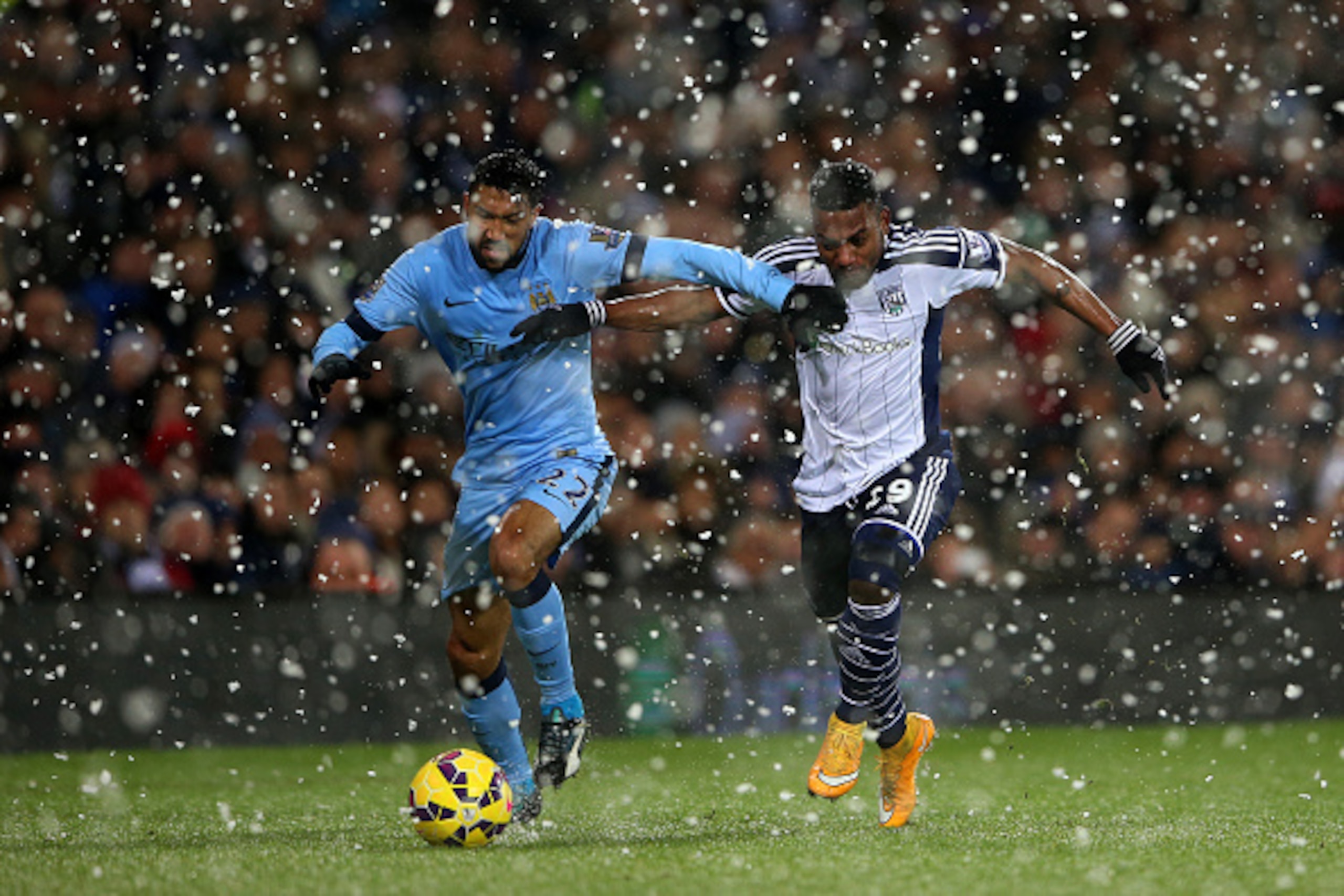 WEST BROMWICH, ENGLAND - DECEMBER 26:  Gael Clichy of Manchester City battles for the ball with Stephane Sessegnon of West Brom during the Barclays Premier League match between West Bromwich Albion and Manchester City at The Hawthorns on December 26, 2014