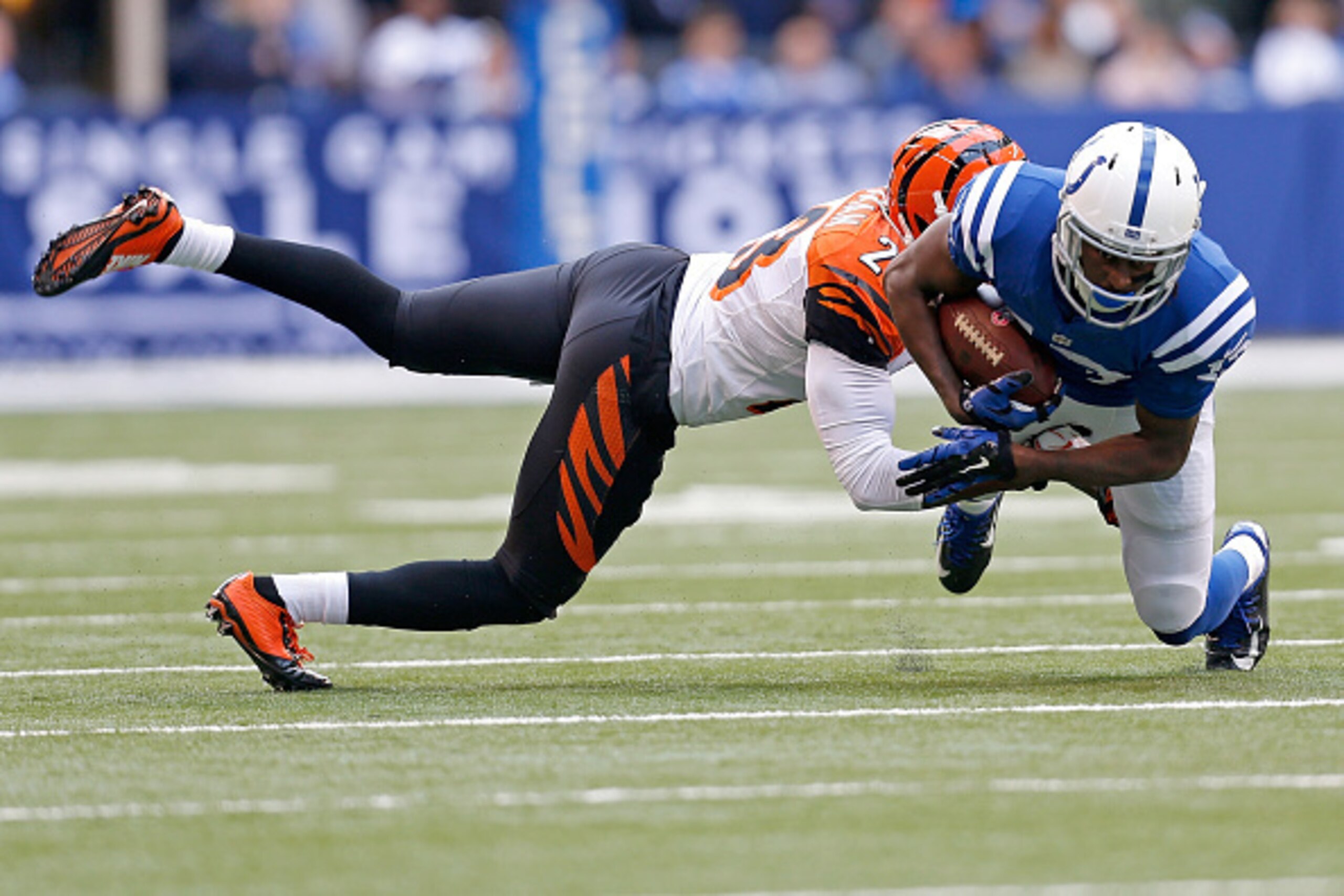 INDIANAPOLIS, IN - OCTOBER 19: Terence Newman #23 of the Cincinnati Bengals tackles T.Y. Hilton #13 of the Indianapolis Colts during the first quarter on October 19, 2014 at Lucas Oil Stadium on October 19, 2014 in Indianapolis, Indiana. (Photo by Kirk Ir