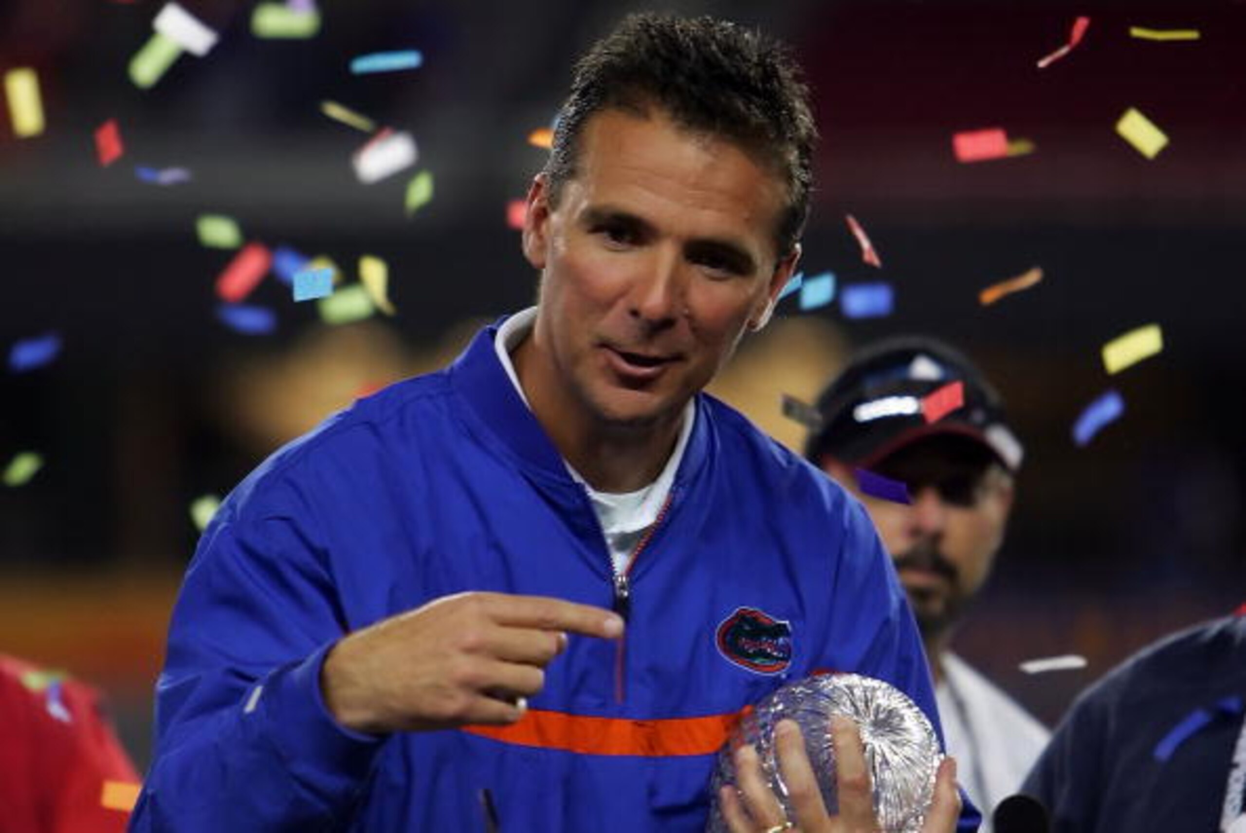 GLENDALE, AZ - JANUARY 08:  Head coach Urban Meyer of the Florida Gators celebrates with the BCS championship trophy after defeating the Ohio State Buckeyes after the 2007 Tostitos BCS National Championship Game at the University of Phoenix Stadium on Jan