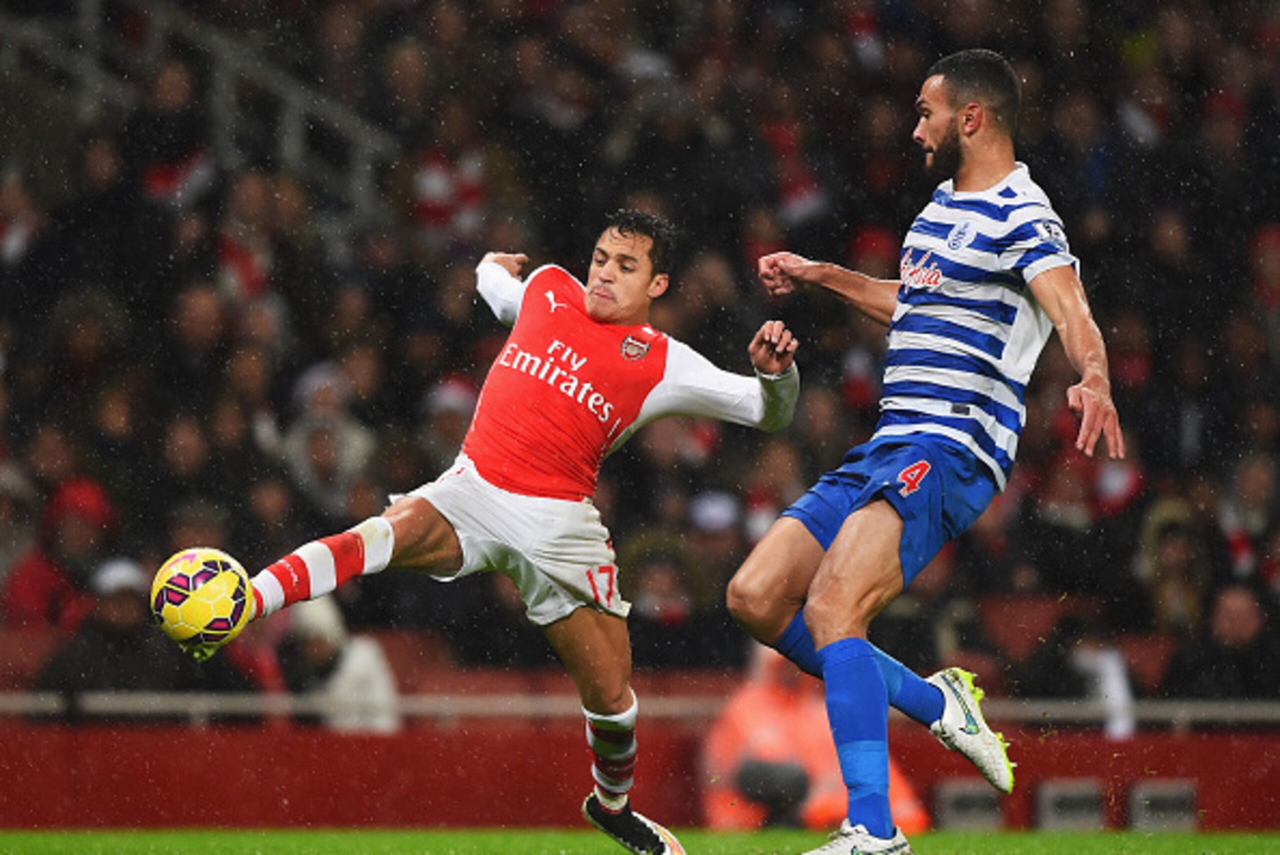 LONDON, ENGLAND - DECEMBER 26: Alexis Sanchez of Arsenal is closed down by Steven Caulker of QPR during the Barclays Premier League match between Arsenal and Queens Park Rangers at Emirates Stadium on December 26, 2014 in London, England. (Photo by Shaun LONDON, ENGLAND - DECEMBER 26: Alexis Sanchez of Arsenal is closed down by Steven Caulker of QPR during the Barclays Premier League match between Arsenal and Queens Park Rangers at Emirates Stadium on December 26, 2014 in London, England. (Photo by Shaun