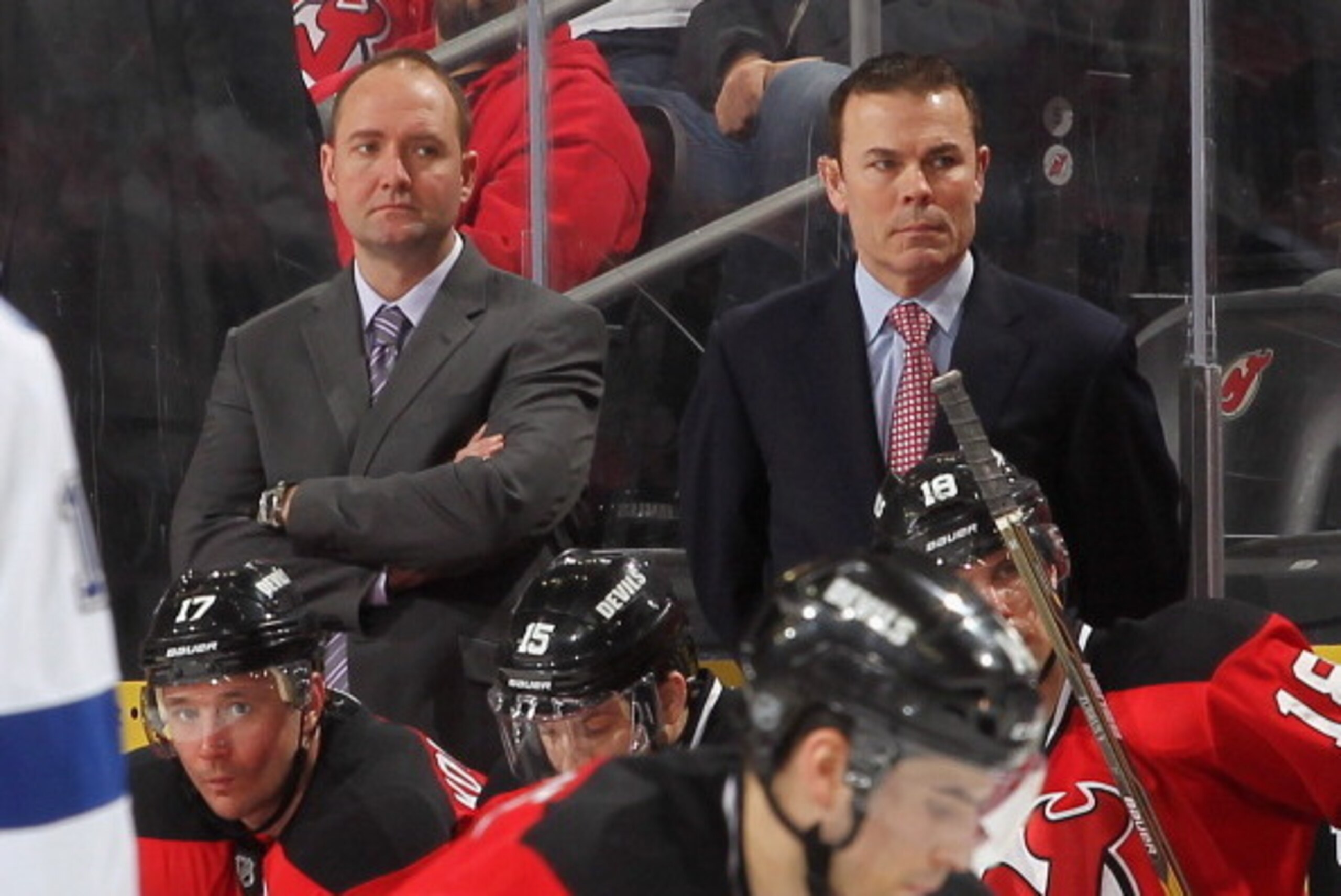 NEWARK, NJ - FEBRUARY 26: Head coach Peter DeBoer (L) and assistant coach Adam Oates of the New Jersey Devils look on against the Tampa Bay Lightning during the game at the Prudential Center on February 26, 2012 in Newark, New Jersey.  (Photo by Andy Marl