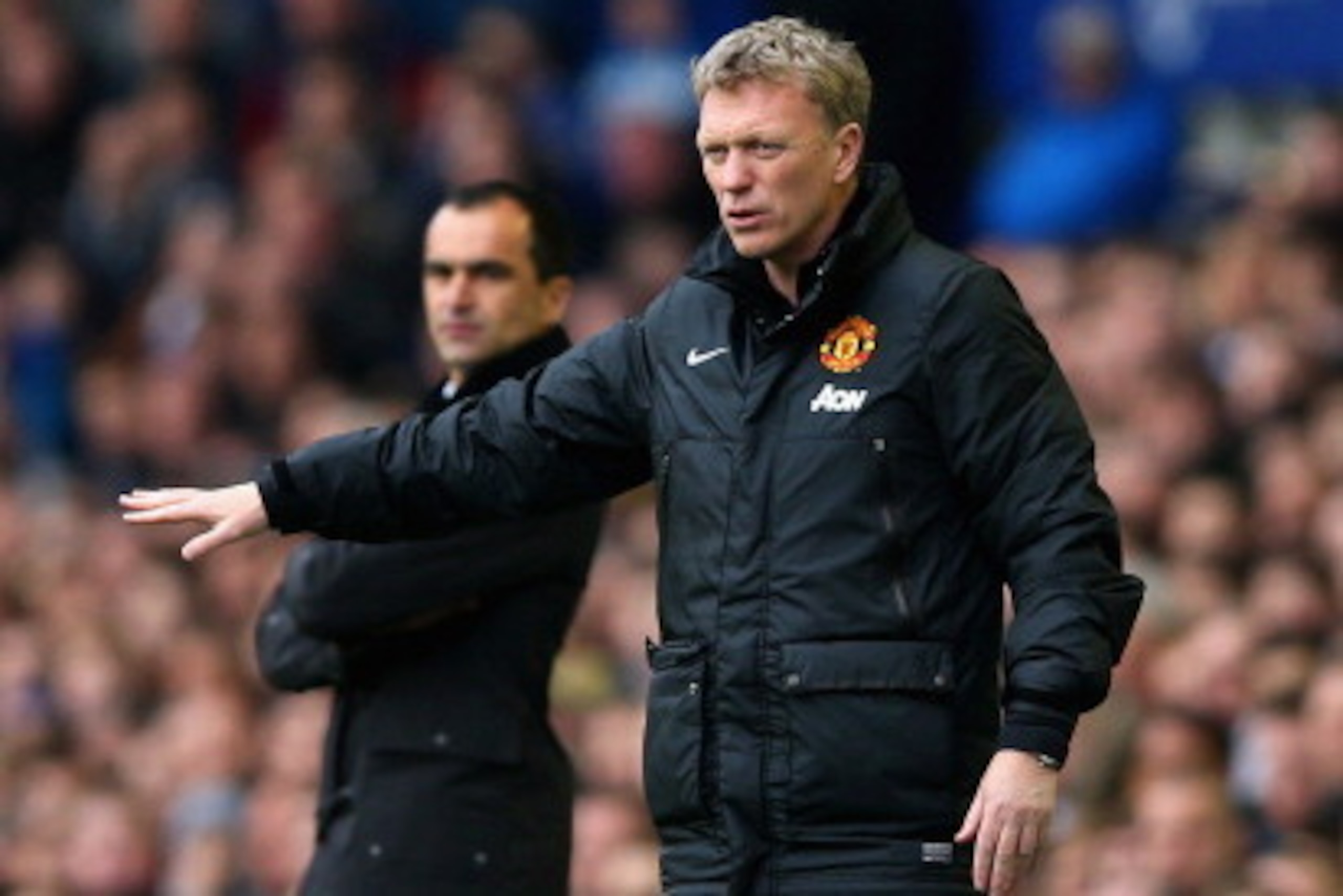 LIVERPOOL, ENGLAND - APRIL 20:  Manager Roberto Martinez of Everton and David Moyes manager of Manchester United on the touchline during the Barclays Premier League match between Everton and Manchester United at Goodison Park on April 20, 2014 in Liverpoo