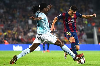 BARCELONA, SPAIN - OCTOBER 18:  Munir El Haddadi of FC Barcelona duels for the ball with Derek Boateng of SD Eibar during the La Liga match between FC Barcelona and SD Eibar at Camp Nou on October 18, 2014 in Barcelona, Spain.  (Photo by David Ramos/Getty