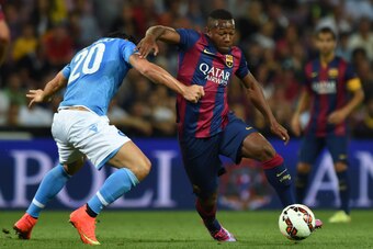 GENEVA, SWITZERLAND - AUGUST 06:  Adama Traore (R) of FC Barcelona is challenged by Blerim Dzemaili of SSC Napoli during the pre-season friendly match between FC Barcelona and SSC Napoli on August 6, 2014 in Geneva, Switzerland.  (Photo by Valerio Pennici