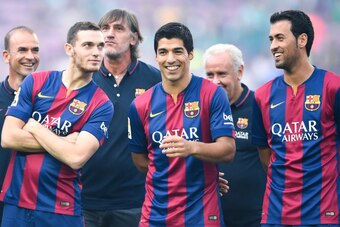 BARCELONA, SPAIN - AUGUST 18:  (L-R) Thomas Vermaelen, Luis Suarez and Sergio Busquets of FC Barcelona share a joke during the official presentation of the FC Barcelona prior to the Joan Gamper Trophy match between FC Barcelona and Club Leon at Camp Nou o