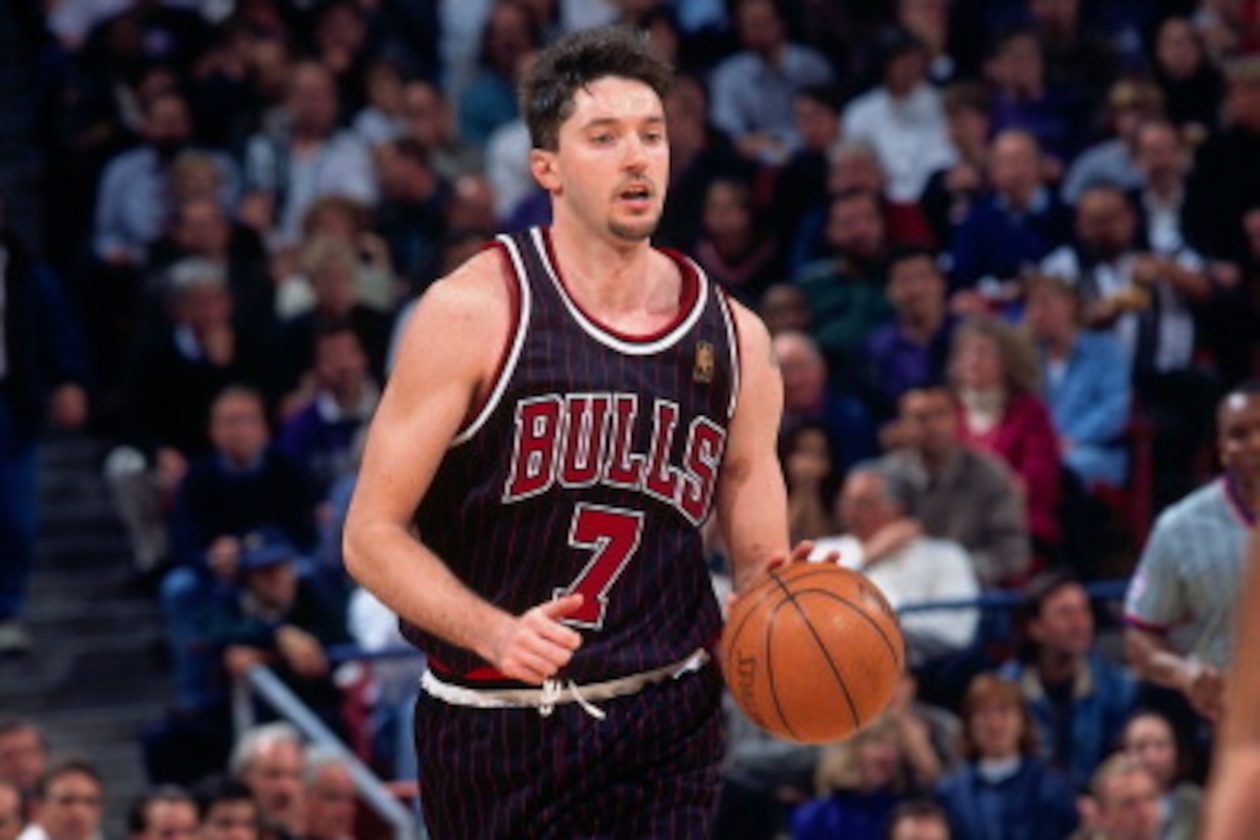 SACRAMENTO, CA - JANAURY 30: Toni Kukoc #7 of the Chicago Bulls dribbles the ball against the Sacramento Kings  during a game played on January 30, 1997 at Arco Arena in Sacramento, California. NOTE TO USER: User expressly acknowledges and agrees that, by
