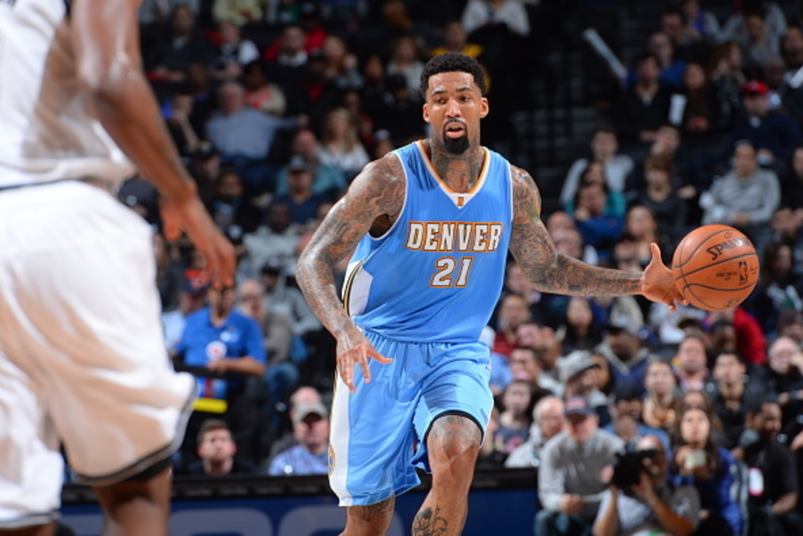 BROOKLYN,NY - DECEMBER 23: Wilson Chandler #21 of the Denver Nuggets dribbles the ball up the court against the Brooklyn Nets on December 23, 2014 at the Barclays Center in Brooklyn, NY. NOTE TO USER: User expressly acknowledges and agrees that, by downlo