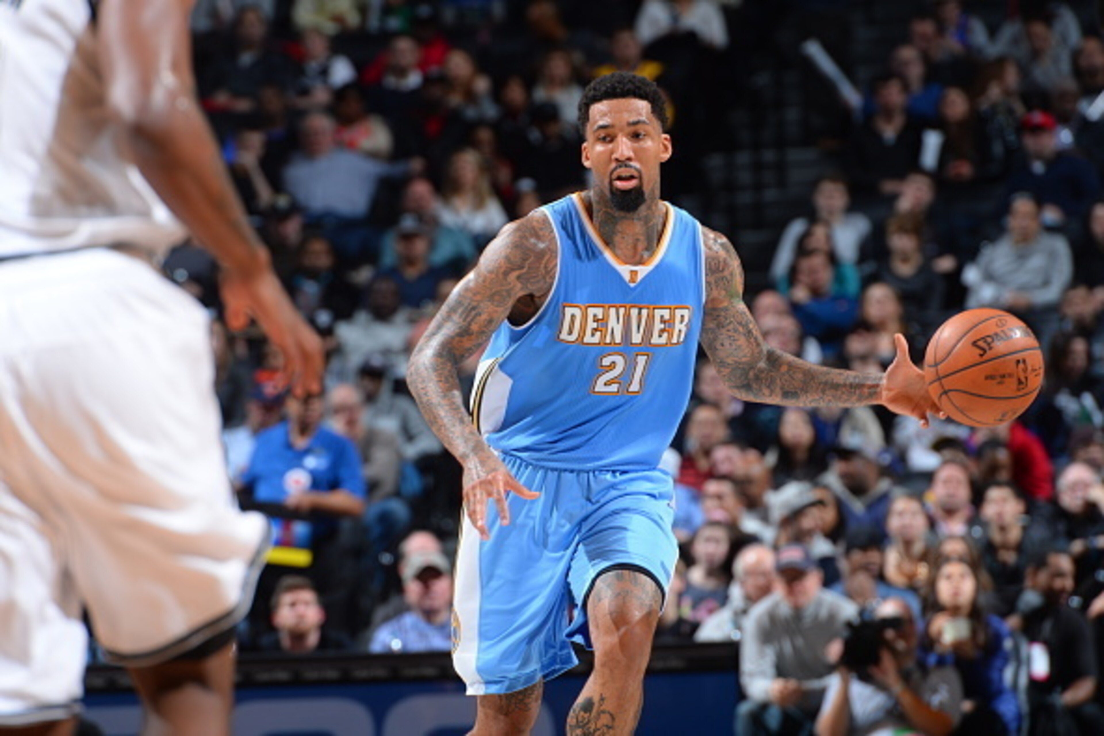BROOKLYN,NY - DECEMBER 23: Wilson Chandler #21 of the Denver Nuggets dribbles the ball up the court against the Brooklyn Nets on December 23, 2014 at the Barclays Center in Brooklyn, NY. NOTE TO USER: User expressly acknowledges and agrees that, by downlo