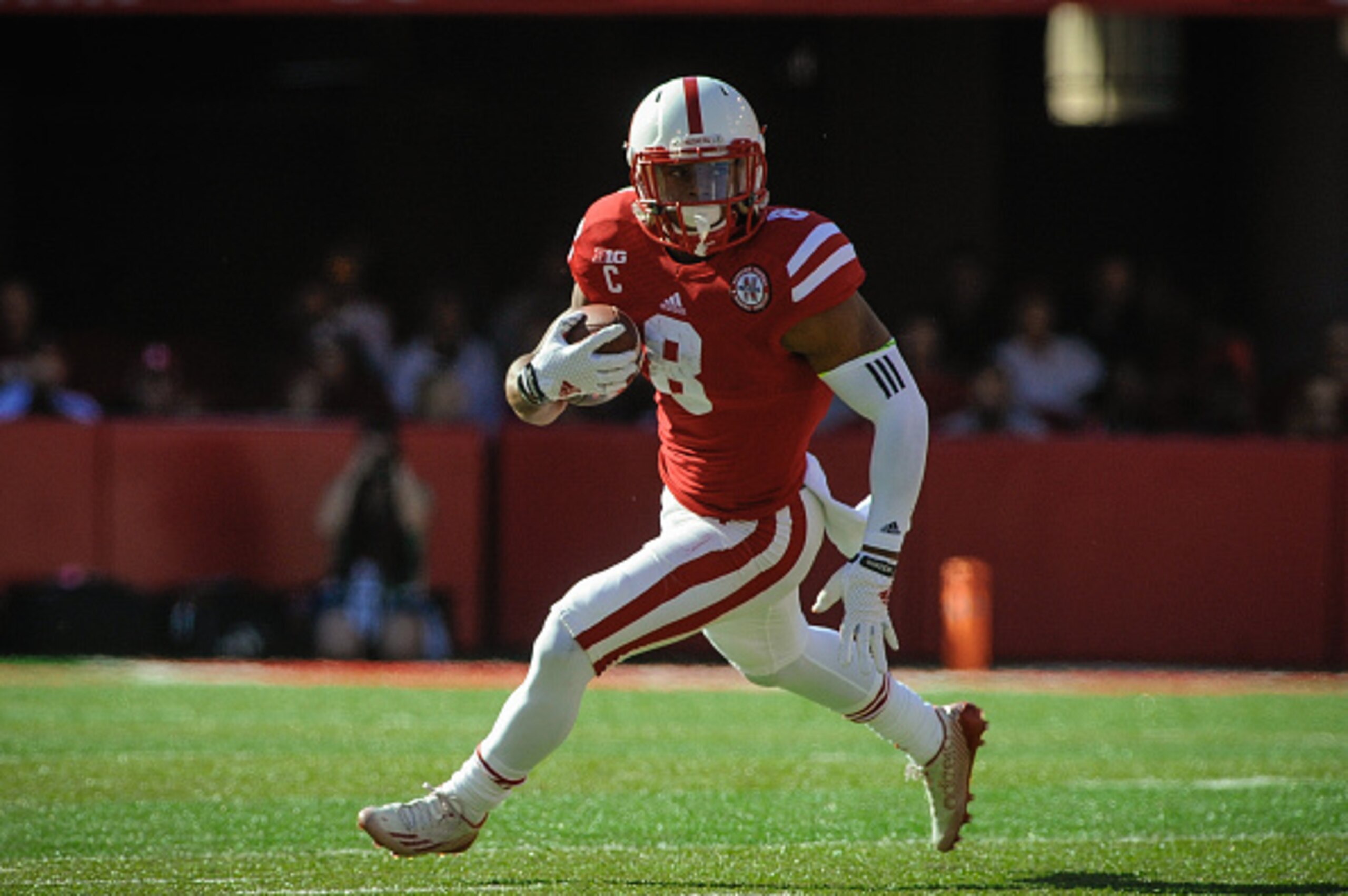 LINCOLN, NE - OCTOBER 25: Running back Ameer Abdullah #8 of the Nebraska Cornhuskers runs for a touchdown during the game against the Rutgers Scarlet Knights at Memorial Stadium on October 25, 2014 in Lincoln, Nebraska. Abdullah set a school record for ca