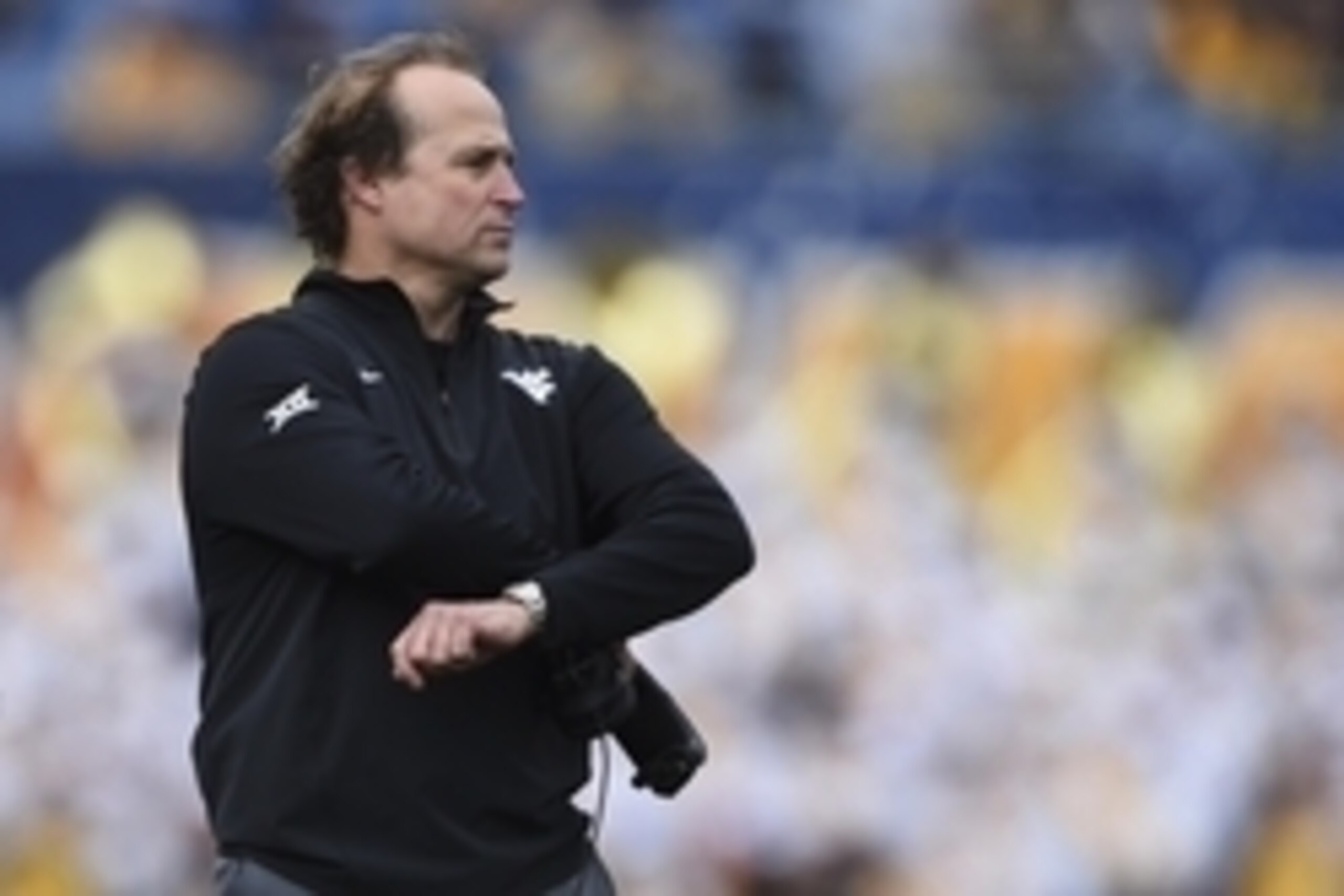 Oct 18, 2014; Morgantown, WV, USA;  West Virginia Mountaineers head coach Dana Holgorsen stands on the sidelines during the second quarter  against the Baylor Bears at Milan Puskar Stadium. Mandatory Credit: Tommy Gilligan-USA TODAY Sports