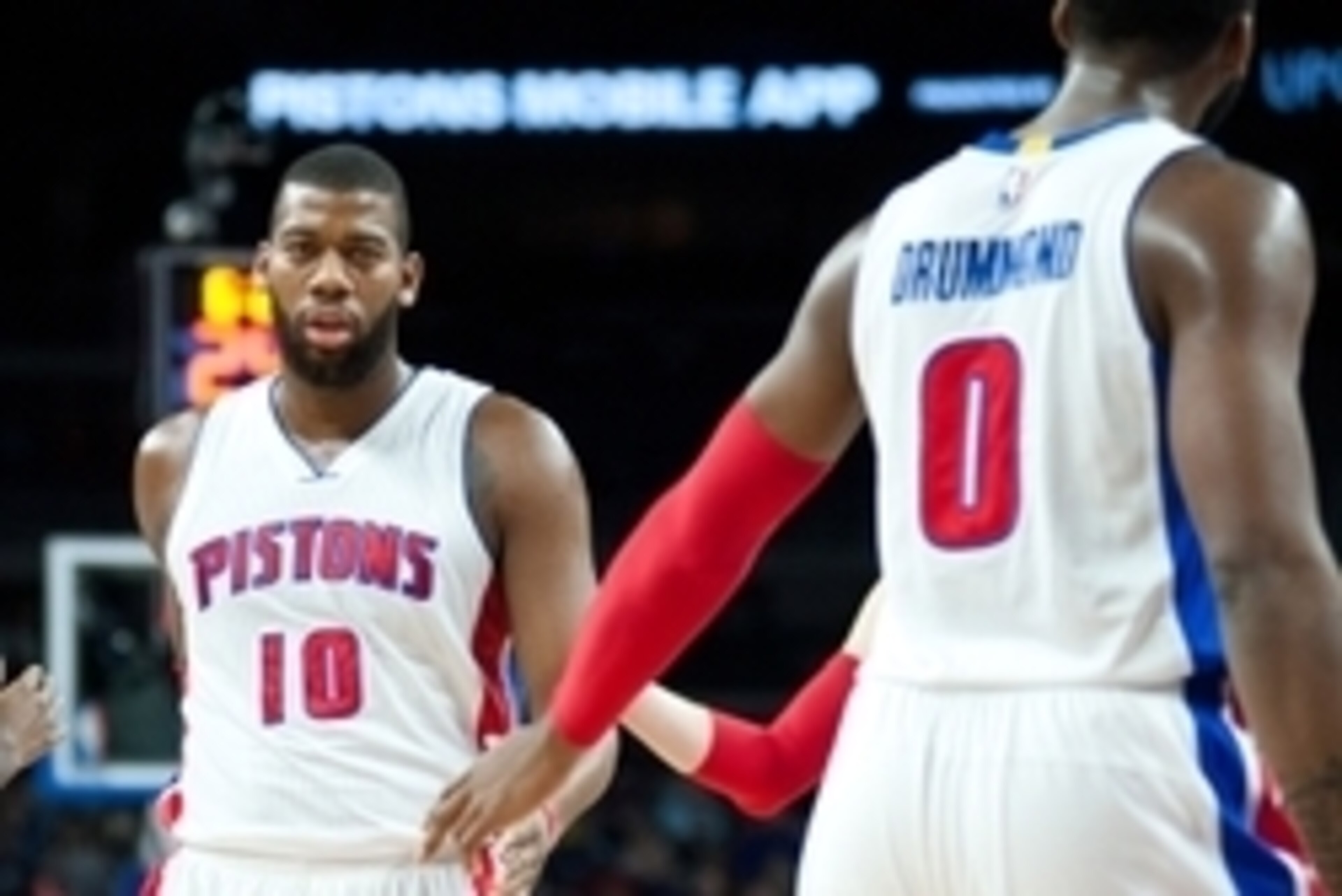 Dec 26, 2014; Auburn Hills, MI, USA; Detroit Pistons center Andre Drummond (0) high fives forward Greg Monroe (10) during the first quarter against the Indiana Pacers at The Palace of Auburn Hills. Mandatory Credit: Tim Fuller-USA TODAY Sports