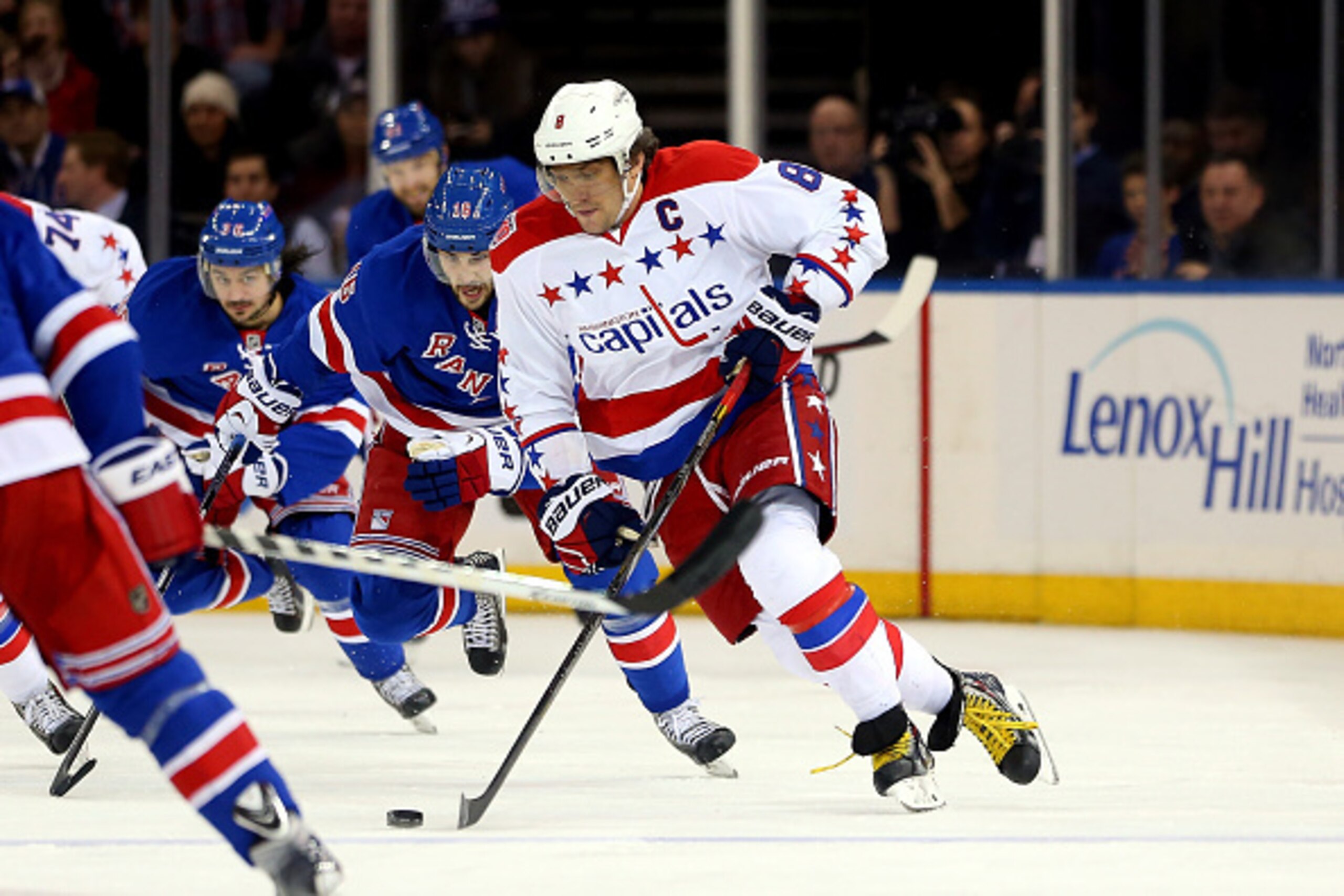 NEW YORK, NY - DECEMBER 23: Alex Ovechkin #8 of the Washington Capitals brings the puck up the ice against the New York Rangers during a game at Madison Square Garden on December 23, 2014 in New York City.  (Photo by Alex Trautwig/Getty Images)