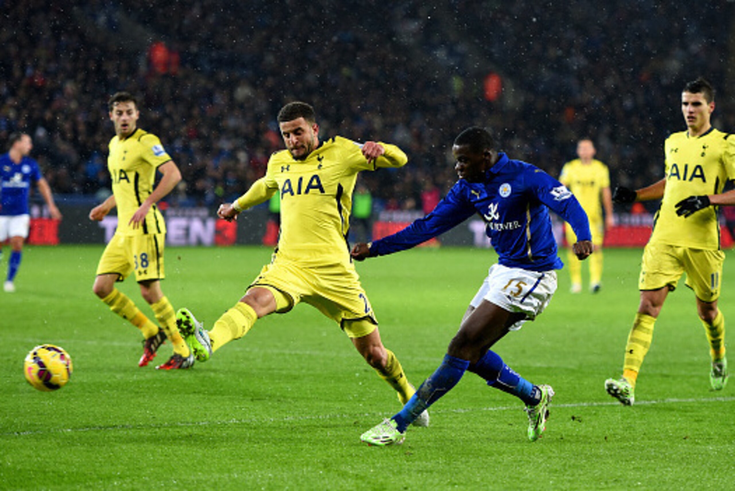 LEICESTER, ENGLAND - DECEMBER 26:  Jeffrey Schlupp of Leicester City shoots at goal under pressure from Kyle Walker of Spurs during the Barclays Premier League match between Leicester City and Tottenham Hotspur at The King Power Stadium on December 26, 20