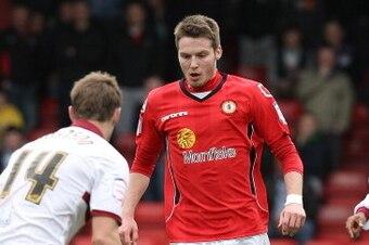 CREWE, ENGLAND - MARCH 31:  Nick Powell of Crewe Alexandra moves against John Johnson of Northampton Town during the npower League Two match between Crewe Alexandra and Northampton Town at The Alexandra Stadium on March 31, 2012 in Crewe, England.  (Photo